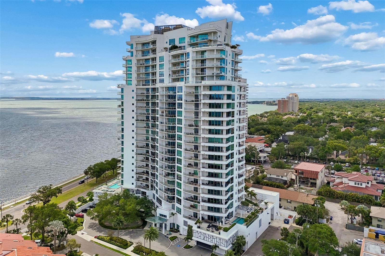 Welcome to Virage Bayshore, where contemporary architecture meets the timeless
prestige of Tampa's most iconic avenue. Perched on the 5th floor of this premier
waterfront tower, Residence 504 offers the rare combination of expansive interior living
and nearly 900 square feet of private outdoor space…all framed by direct, unobstructed
views of Tampa Bay.
Step from your private elevator directly into the residence, where 10-foot ceilings and
floor-to-ceiling glass walls welcome you with sweeping bayfront vistas and brilliant
natural light. Spanning 3,237 thoughtfully designed square feet, the open-concept layout
features three bedrooms, three ensuite baths, one half bath, and a versatile den…all
finished with custom designer wallpaper, all-new lighting, and automated Shade Store
blinds throughout….the kind of considered detail rarely found at this price point.
The chef's kitchen is outfitted with a Wolf gas cooktop, Wolfe built in ovens, Sub-Zero
refrigerator and a Sub-Zero wine refrigerator at the dry bar. The primary suite is a true
retreat, with a sitting area, spa bath with glass shower and soaking tub, oversized walk-
in closet, and direct terrace access framing the bay. Two expansive terraces capture
sunrise reflections off the downtown skyline from one side and effortless sunset views
from the other.
Virage's amenities elevate everyday living: 24-hour concierge, bayfront infinity pool and
heated spa, state-of-the-art fitness center, dog park with grooming room, guest suites
for visitors, and a clubroom for private events. Residence 504 includes two oversized
assigned parking spaces in the enclosed garage and a private storage closet on the
same floor. Available fully furnished as a separate negotiation.
Bayshore Boulevard living, refined and ready to enjoy.