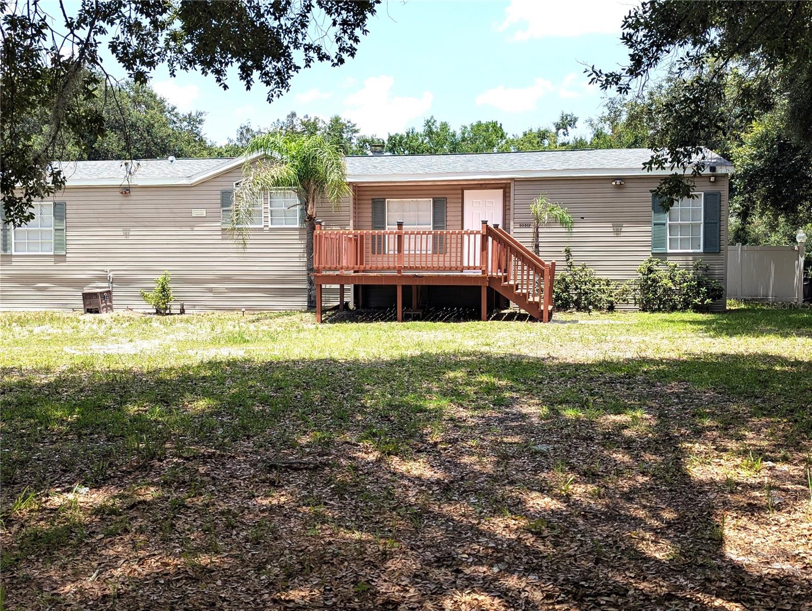 I am excited to share a fantastic new property listing in Wesley Chapel that offers the perfect blend of country living, modern charm, and convenience—with no HOA fees and located outside of a flood zone.  This is a remodeled 3-bedroom, 2-bathroom home offering over 1,700 sq. ft. of living space and is situated on a spacious 1-acre corner lot. It features an open floor plan with a large kitchen overlooking the living room, abundant natural light from numerous windows, a cozy fireplace, and both front and rear porches.
   Perfect location giving you the freedom to create your own private oasis. It's Located just 1.6 miles from the Wesley Chapel Recreation Complex and Cricket Stadium, approximately 2 miles from local schools, and only 5 minutes from the new Johns Hopkins Children's Hospital currently under construction.This is a unique opportunity to own a spacious, worry-free property in a highly desirable location. Please let me know if you would like to schedule a private viewing or if you have any questions.