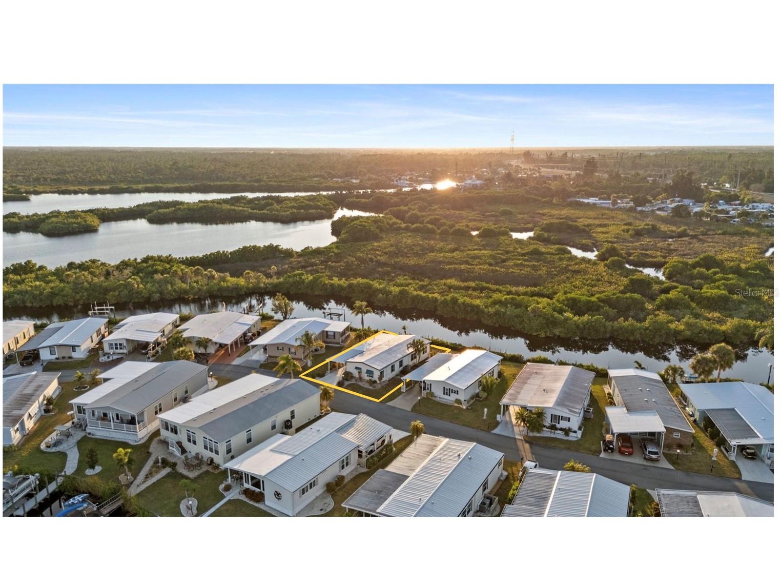 Welcome to Lazy River Village! One of the premiere (if not THE best) 55+ waterfront manufactured park in all of Sarasota and Charlotte counties! The BEST amenities, clubs, and selection of activities you will find in any co-op park in all of Sarasota county and even Charlotte County. Lazy River is located on the banks of the beautiful Myakka River. This 2 bed 2 bath home needs a few improvements, such as flooring. Light, bright, and airy, this well-maintained home makes every day feel like you're on vacation. Serene water views provide a backdrop of peace and natural-living. Newer roof. Washer & dryer. ALL FURNISHINGS CONVEY. You can live the quintessential Florida lifestyle as soon as the ink dries on the closing papers! This home is the perfect seasonal place to enjoy Florida's coveted gorgeous winters and a perfect year-round home for those who love all 4 seasons of Florida. If you enjoy an abundance of activities, you will have plenty to choose from in Lazy River Village: Pickleball, tennis, bike clubs, card clubs, and pontoon boating. They even have a professional woodworking shop. A low monthly fee of $288 includes all the amenities. There are other amenities for an extra fee, such as a marina slip if your home is not located on the water. 

One of the things that makes Lazy River Village so great is its proximity to...well...everything! Be prepared to enjoy Florida's wildlife at its finest, both inside the Lazy River Village complex and at abundant state parks and nature preserves. Shopping and dining surround you in all directions. The spring training homes of both the Atlanta Braves & the Tampa Bay Rays are just a minutes away. The world-renowned Gulf beaches are all within 30 minutes or less! 1) Englewood beach, 2) Casperson Beach (GREAT for shelling), 3) Venice Beach (shark tooth capital of the world), 4) Brohard Paw Park, 5) Nokomis beach (you've GOT to experience the weekly drum circles), 6) the island gem of southwest Florida: Boca Grande... And finally: 7) Siesta Key in Sarasota has been ranked multiple times as the number one beach in the nation and is a mere 35 minutes away. Lazy River Village offers a lifestyle that every retiree dreams of. You have the quaint downtowns of Venice and Punta Gorda--both cities are often ranked as Top 10 destinations in the country for retirement. Another local favorite, Englewood, is a cozy, fun beach town on the Gulf. 

The residents of Lazy River Village agree: Lazy River is a community that offers it all. Don't miss your chance to see this home!