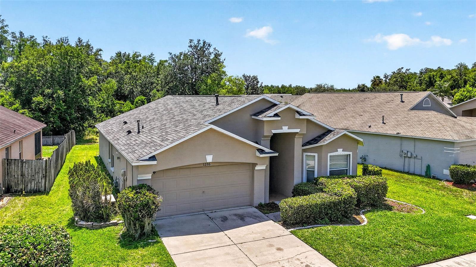 Nestled on a quiet cul-de-sac in the GATED COMMUNITY of Meadow Pointe, this 4-bedroom, 3 Full bath home is situated on a premium conservation homesite with no rear neighbors and showcases a private wooded backdrop, and an oversized extended screened lanai.
Inside, the 3-way split floor plan provides exceptional privacy and flexibility for families, guests, or multi-generational living. FRESHLY PAINTED interiors and NEW CARPETING IN BEDROOMS installed in 2026 create a crisp, move-in-ready feel, while NEWER LUXURY VINYL PLANK FLOORING throughout the main living areas adds both style and durability. The spacious great room features vaulted ceilings, abundant natural light, and triple sliding glass doors that seamlessly connect indoor and outdoor living spaces.
The kitchen offers ample cabinetry, a breakfast bar, a breakfast nook, and a functional layout. A cozy dining area with built-in hutch adds charm and character. The OWNER’S RETREAT is tucked away from the secondary bedrooms and features a large walk-in closet, dual vanities, soaking tub, separate shower, and linen closet.
The SECONDARY BEDROOM is positioned near a full bath, making it perfect for guests or a home office, while TWO ADDITIONAL BEDROOMS share a convenient Jack-and-Jill bath. UPGRADES INCLUDE a NEW AC installed in 2026, roof replaced in 2019, 2024 washer, 2023 dishwasher, and 2022/2023 microwave. GAS APPLIANCES include a gas range, gas tankless water heater. COMMUINITY FEATURES: mature landscaping, larger homesites, enhanced privacy, and access to outstanding amenities including a resort-style pool, clubhouse, tennis courts, basketball courts, beach volleyball, playgrounds, shuffleboard, and numerous community events throughout the year.
Conveniently located NEAR TOP RATED SCHOOLS, shopping, dining, hospitals, and major highways, this exceptional Meadow Pointe home delivers the lifestyle, setting, and upgrades buyers have been searching for.