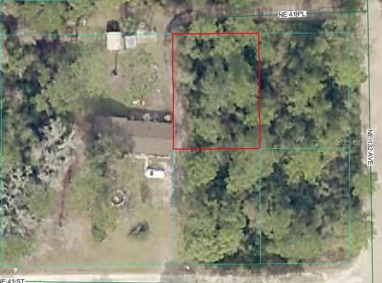 Welcome to your perfect Florida escape! This beautiful vacant parcel on NE 41st Pl offers an incredible opportunity to build your custom home or place your next investment property in the heart of Silver Springs. Tucked away in a peaceful country setting, you will enjoy plenty of privacy while remaining just minutes from everyday conveniences. Outdoor enthusiasts will fall in love with the location—enjoy easy access to the world-famous Silver Springs State Park, the Ocala National Forest, and a network of pristine lakes and rivers perfect for boating, fishing, and kayaking. Bonus Opportunity: The adjacent lot (Parcel 1661-004-023) is also available! Purchase both to create an oversized double lot for ultimate privacy or a side-by-side build project. No strict HOA fees or time frames to build. Buyer is responsible for performing all due diligence regarding zoning, utilities, and building requirements with Marion County. Drive by and envision your future home today!