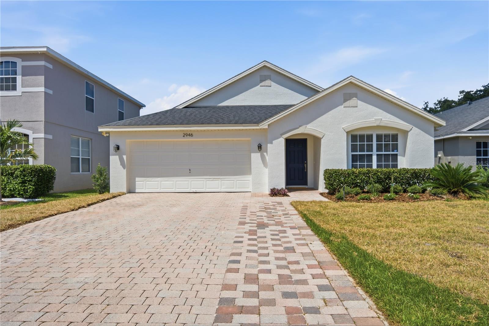Welcome to refined Florida living in The Sanctuary, one of Oviedo's most sought-after communities. This beautifully NEWLY RENOVATED 4-bedroom, 2-bath residence has been thoughtfully updated with sophisticated finishes and modern comforts, creating a home that is both elegant and move-in ready.

From the moment you arrive, you'll appreciate the fresh curb appeal with new exterior paint, lush new sod, and professionally updated landscaping. Inside, the home renovations include  fresh interior paint, luxury vinyl plank flooring, new baseboards, stylish new lighting, new toilets and new carpet in two of the secondary bedrooms. The impressive kitchen features granite countertops, prep island/breakfast bar,  and 42-inch cabinetry, offering the perfect blend of style and functionality.

The open-concept floor plan is enhanced by soaring ceilings in the family room, creating a bright and airy gathering space that flows effortlessly into the kitchen and adjoining living and dining areas—perfect for entertaining or everyday living.

The private primary suite serves as a relaxing retreat, featuring a beautifully updated en-suite bath with a new double-sink vanity, updated lighting and fixtures along with a luxurious soaking tub, and a separate walk-in shower. The spacious walk in closet is opposite the ensuite and creates a truly impressive private oasis.  Three additional bedrooms provide flexibility for family, guests, or a home office.
Enjoy outdoor living with the fully fenced backyard and incredible paved patio that is partially covered for staying cool on those hot Florida days.

Additional highlights include a 7-year-old air conditioning system that has been recently serviced, providing added peace of mind.

Located in the heart of Oviedo, residents of The Sanctuary enjoy an exceptional lifestyle with resort-inspired amenities including a community pool, fitness center, playground, parks, tennis court and scenic walking trails. Just minutes from top-rated Seminole County schools, shopping, dining, and major commuter routes, this home offers the perfect balance of luxury, convenience, and community.

Experience elevated living in one of Oviedo's premier neighborhoods—this exceptional home is ready to welcome you.