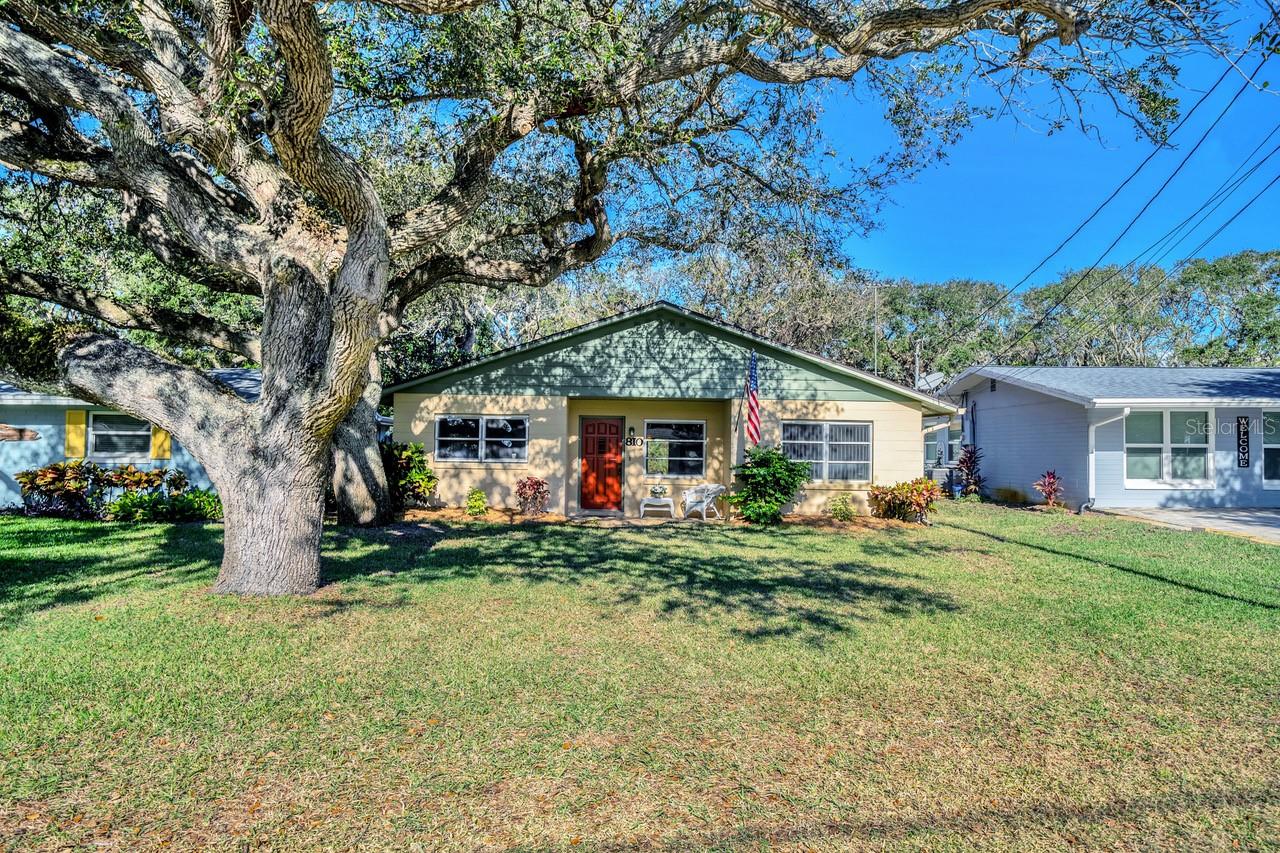 Known as the "Story Book" house, the charm is very evident as you arrive taking in the magical Live Oak Trees and the custom built front door. This home has been well cared for since it was built by the current owners. Solid concrete block construction, freshly painted on the interior and the roof replaced in 2014 the storms have been weathered very well here. There is even a concrete block storage shed in the back yard to safely store beach toys and yard equipment. As you enter the home the large 1892 square footage will impress upon you in comparison to many other bungalows in the neighborhood. The home features two bedrooms and 2 bathrooms separated on each end of the home for privacy. Ample living areas as there are potentially three living rooms, including a florida room at the rear where most will spend most of their time basking in the sunlight of many windows. Or transition one of the living areas into a third bedroom to accommodate more beach visitors. The kitchen is spacious with a large pantry flanked by a very useful indoor utility/laundry room. There are many possibilities to make this lovely home shine with your personal touches. The location tops off the amazing benefits of the home. You are steps to the beach at the end of 10th Ave where there is a very convenient Beach walkover. Or head steps west to walk the nature trail with river viewing access. Schedule your showing today to experience this wonderful home enjoyed by so many family members since its inception! ;Water: City