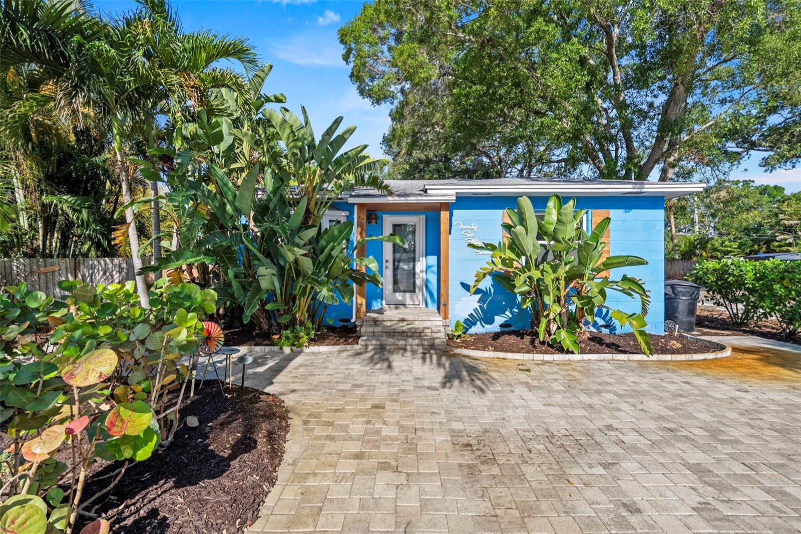 Gulfport Marina District DOUBLE LOT Residence! Mature tropical landscaped 2-bedroom, 2-bath block construction bungalow located just two blocks from the Gulfport Municipal Marina featuring an open split floor plan with 1,688 square feet of comfortable living space. Situated on a rare double lot, the home offers exceptional outdoor space and potential. The property was flood impacted by the 2024 Hurricane, and remediation has been completed. The photos include views of the home prior to the 2024 Hurricane storms, showcasing what it could once again become, offering a fantastic opportunity for the next owner to add their personal design touches. The home thoughtfully included recessed LED lighting, sleek ceiling fans, hurricane impact windows and sliders, a modern kitchen design, and a beautifully renovated primary en-suite featuring a skylight. A new A/C system installed in 2024 adds further value and efficiency. New custom-designed lower kitchen cabinets are on-site and ready for installation. The Bonus Room offers multi-use options, perhaps an office space or a 3rd bedroom? Large windows include a sizable bay window filtering an abundance of south-facing natural light. Plenty of parking curtesy of the spacious front driveway, additionally, the gated carport accessible from the rear alley provides security, privacy and cover. Storage Sheds and an additional shed platform adds to the outdoor conveniences found in this lovely home. Life in Gulfport is relaxed, colorful, and full of character. This charming waterfront community is known for its vibrant arts scene, walkable streets, and welcoming small-town feel. Residents enjoy waterfront sunsets at the Municipal Beach, strolling along the shops and restaurants and gathering for popular local events like the Gulfport Art Walk and the weekly Gulfport Tuesday Fresh Market. With beautiful beaches just minutes away and the culture and energy of St. Petersburg nearby, Gulfport offers a unique coastal lifestyle where art, boating, dining, and community come together to create an unforgettable place to live. Take advantage of this opportunity to create your own coastal retreat and enjoy the best of Gulfport living.
