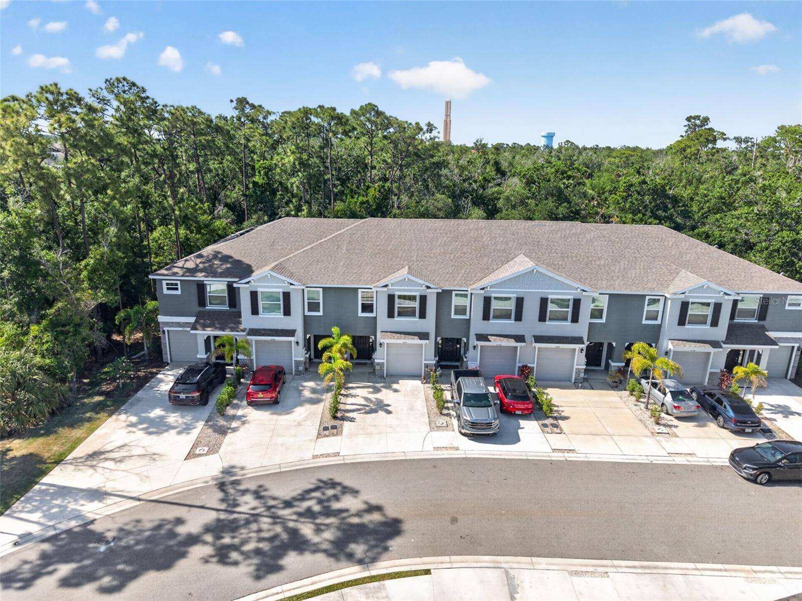 Welcome to the highly desirable Bay Landing community, where modern design meets effortless Florida living. Built in 2022, this beautifully maintained townhome with designer touches throughout features 3 bedrooms, 2.5 bathrooms, and an attached one-car garage—ideal for full-time residents or seasonal enjoyment. 

Step inside to a bright, open-concept floor plan designed for both everyday living and entertaining. The spacious kitchen is a standout, complete with granite countertops, stainless steel appliances, a generous pantry, and a stainless appliances. The living and dining areas flow seamlessly to a screened-in lanai—where this home truly shines—overlooking a private, wooded backdrop that offers a rare sense of peace and privacy not often found in the community. It’s the perfect setting for relaxing mornings or quiet evenings.

Upstairs, the oversized primary suite serves as a peaceful retreat with a large walk-in closet and en-suite bath. Two additional bedrooms and a full bath offer flexibility for family, guests, or a home office.

Built for durability and peace of mind, this home features all concrete block construction with quality craftsmanship. Bay Landing is a maintenance-free community with no CDD fees and low HOA fees, offering resort-style amenities including a clubhouse, sparkling swimming pool, fitness center, tot-lot, and dog park.

Ideally located just minutes to I-75 for easy commutes along with close convenience to UTC, Waterside, downtown Sarasota, and world-renowned Gulf Coast beaches, this home delivers the perfect combination of comfort, great location and the ultimate Florida lifestyle—enhanced by one of the most private and serene settings in the neighborhood.