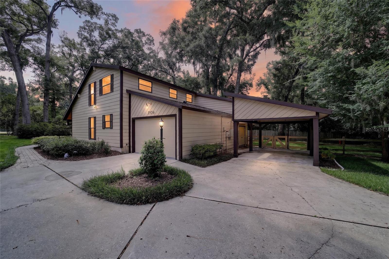 Exciting opportunity! This beautiful 3-bedroom, 2 full-bath home is back on the market solely due to the seller's job transfer out of state. Located in the desirable Southeast Ocala, this gorgeous residence with a circular driveway offers a perfect blend of comfort, character and curb appeal. Step inside to find beautiful wood floors, tinted sliding glass doors and stunning exposed timber beams that add warmth, charm, and timeless architectural attributes. The thoughtfully designed floor plan with 17-foot ceilings is filled with natural light, and natural beauty. The versatile home theater room can double as a media room, game room, man cave or a home office. This new renovated spacious kitchen features solid wood cabinetry and granite counter space. A kitchen made for entertaining with all new appliances. The striking brick wall and cast-iron wood- burning stove creates a perfect focal point. Walk inside the garden to find professionally manicured landscaping with citrus and fruit trees, an irrigation well and a fenced backyard for your furry friends to play in and you to barbecue during those picturesque Florida evenings. Included is 12 X 14 workshop off the garage as well as a 2020 generator and a new 2021 roof. A one of a kind Florida home!