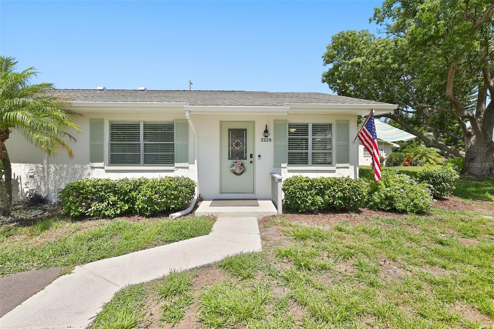 Welcome to this beautifully maintained York model nestled on a quiet cul-de-sac in the desirable Gloucester J Condominium Association of Kings Point. This charming one-bedroom, one-and-a-half-bath home lives much larger than expected thanks to the enclosed Florida room, creating the perfect space for a guest room, home office, hobby room, den, or reading retreat.

The bright, open floor plan features laminate flooring throughout the main living areas with tile in the kitchen and bathrooms. The updated kitchen is appointed with granite countertops, newer appliances, and a counter-depth refrigerator for a clean, modern look. Smooth ceilings in the living room and kitchen add to the home’s updated appeal.

Recent improvements include an upgraded electrical panel, newer plumbing, newer toilets, a hot water heater approximately six years old, and exterior painting completed in 2026. Wood push-up blinds accent the living room and lanai, while cordless wood blinds provide style and convenience in the bedroom.

Step outside the Florida room to your own private patio, a peaceful garden setting where the current owner has lovingly grown orchids and beautiful flowers. Beyond the Florida room is a spacious utility room with the washer and dryer, abundant storage, and enough room to park your golf cart.

With approximately 1,096 square feet under roof, including the enclosed Florida room, utility room, finished carport, and porch, this home provides exceptional flexibility, storage, and everyday comfort beyond its living area.

Enjoy the exceptional Kings Point lifestyle with multiple clubhouses, indoor and outdoor pools, fitness centers, pickleball, tennis, golf, restaurants, arts and crafts, live entertainment, and hundreds of social clubs and activities. Conveniently located near shopping, medical facilities, Tampa, Sarasota, and Florida’s stunning Gulf Coast beaches, this home is the perfect place to enjoy the very best of Florida living.