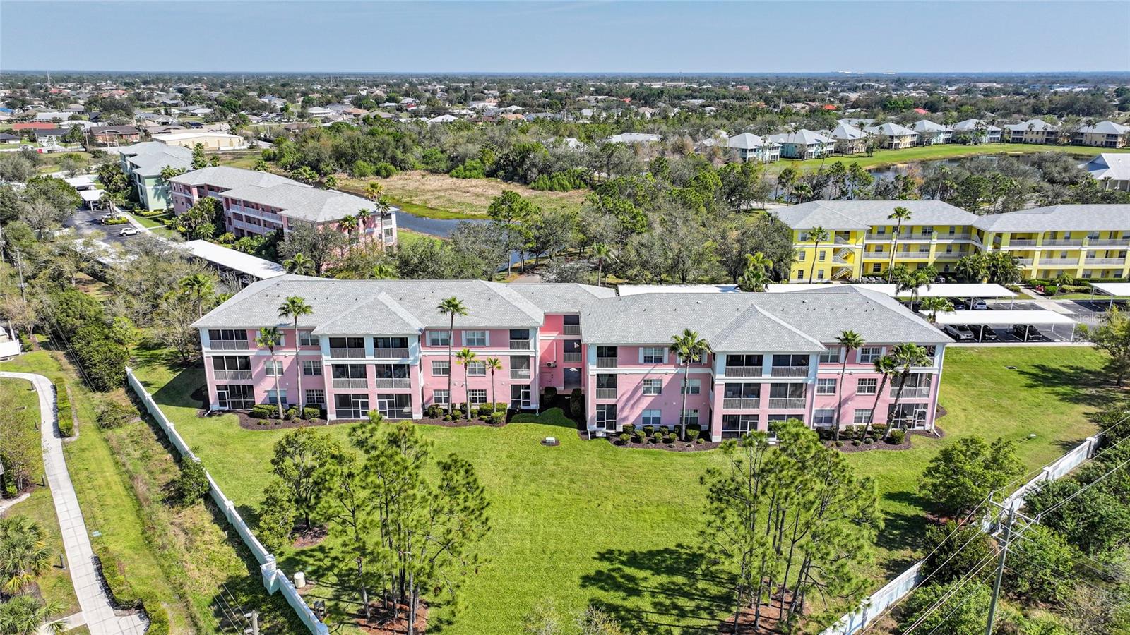 Welcome to the highly sought after gated community of Heritage Lake Park in Deep Creek! This 2 bed 2 bath ground floor condo features tile flooring throughout and is move in ready! As you enter through the front door, you are greeted by a large open space for dining, living, and entertaining; all leading out to your very own private lanai. The kitchen features a breakfast bar & plenty of cabinets for storage! Both bedrooms are large in size and are on opposite ends of the condo to allow privacy for your guests. Enjoy spending time on your screened in lanai taking in the peaceful views this community offers. This unit has an interior laundry room and comes with a covered carport. Featuring some of the best amenities any complex can offer with a large in ground pool, gorgeous club house with a library, pickleball/tennis courts, fitness center, sidewalks, & beautiful landscaping. You will never be bored with all of the activities this lively community offers! This beautiful Punta Gorda community is conveniently located to shopping, dining, golf, medical, entertainment, and much more! Make your appointment to see this one today.