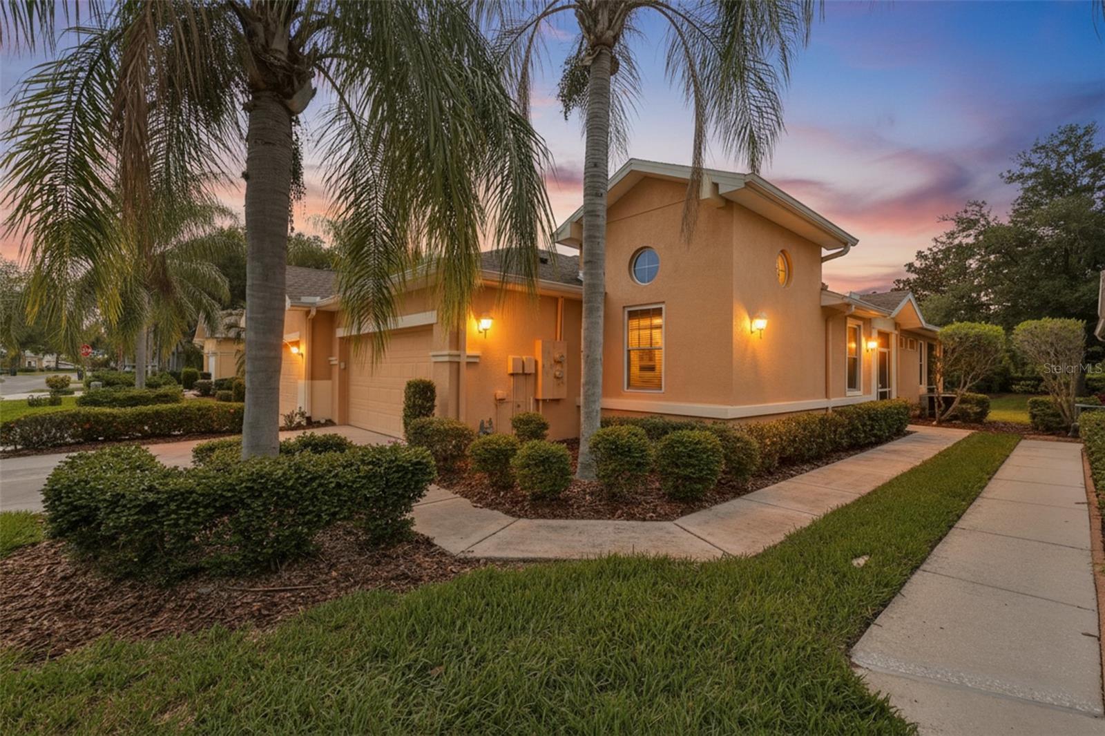 Outstanding Haddington Model in the Portsmith section of Beautiful King's Point, a Premier Very active 55+ Golf Cart Community with 24hr guarded gate! From the moment you enter the front screened porch & into the foyer, this home is will WOW you with its spacious open floor plan featuring wood flooring in the living room, tile in the kitchen, dining room, baths & laundry. BONUS: 2 bedrooms have been UPDATED with gorgeous Porcelain Tile! The Chef's Gourmet kitchen has white 42 inch cabinets accented with crown molding, granite countertops & breakfast bar, tiled backsplash & includes ALL Appliances! Stove can be easily converted, as Gas is available! The inviting Primary Suite has a walk-in closet, en-suite bathroom with white cabinetry, Corian countertops & step-in shower. The split floorplan provides privacy for guests staying in the 2nd bedroom, featuring vaulted ceilings, accented with porthole style windows, a spacious closet & guest bath has tub & shower just steps away! 2 Solar Tube Skylights adds to the bright ambience of this home! Laundry room is off the kitchen with cabinets & a utility tub! The spacious lanai has a embossed style floor overlooking your lush green rear lanscaped yard with mature growth & swaying Palm trees, providing privacy. The garage has Painted floor, auto door, storage space & shelving, A/C with KPW warranty, Gas water heater & Water Softener! Kings Point blends resort-style luxury with a stress & maintenance free lifestyle and PETS ARE WELCOME in Portsmith! Located near hospitals & close to major airports, shopping, medical facilities & Florida's award-winning white-sand beaches! Enjoy lounging by one of the multiple indoor or outdoor heated pools, play on two exceptional golf courses, tennis, pickleball & lawn bowling courts. There are 2 huge clubhouses with a theater for live entertainment, shows, and concerts, while over 100 social and hobby clubs, ranging from pottery & mah-jongg to billiards & cards! There is an on-site restaurant & bar, food trucks, dances & movie nights, too!  Best of all, this active Florida lifestyle comes with total peace of mind; Newer Roof and newer storm windows, non-Flood Zone X & NO CDD's,The monthly condo fee covers cable, internet, water, sewer, trash, roof replacement, landscaping, & all exterior maintenance. and permits flexible short-term rentals! Welcome to paradise where you can live, laugh & love life!