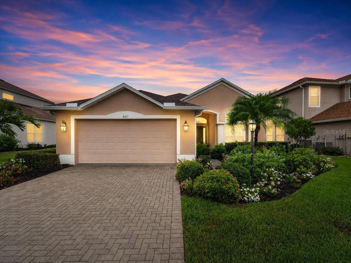 RARE FIND! $150,000 in RECENT UPGRADES, this 4-bedroom, 2-bath HEATED POOL home offers quality construction, modern finishes, and a PRIME LOCATION in the Greenbrook Village Community of Lakewood Ranch. Situated on a premier lot with peaceful POND VIEW, this home has been COMPLETELY RENOVATED, allowing buyers to move in without the expense or hassle of major projects. The OPEN FLOOR PLAN fills the home with natural light and features CERAMIC TILE FLOORING, NO CARPET, CROWN MOLDING, and INTERIOR SHUTTERS throughout the home. The open kitchen showcases STAINLESS STEEL APPLIANCES, GAS STOVE, QUARTZ countertops and large island with bar seating. Both bathrooms have been completely renovated with updated fixtures, finishes and marbled tile. The screened in 15x28 modern SALTWATER POOL with added lighting and water features overlook a large pond, creating a private outdoor space for relaxing or entertaining. Additional exterior features include beautifully maintained landscaping that adds to the home's curb appeal and generator-ready transfer switch for exterior generator connection professionally installed. UPGRADES: NEW roof (2023), NEW pool (2024), NEW pool cage (2024), NEW flooring (2023), FULLY renovated bathrooms (2023), New gutters (2024), NEW water heater (2023). The HOA is only $121 annually, and because the home is located in an X flood zone, flood insurance is not required by most mortgage lenders. Greenbrook Village is located within the highly rated McNeal Elementary, Nolan Middle, and Lakewood Ranch High School districts, the home is also minutes from Main Street Lakewood Ranch, Waterside Place, UTC Mall, shopping, dining, medical facilities, and I-75. This home truly offers the ultimate Lakewood Ranch lifestyle. Don’t miss the opportunity to experience this exceptional property—schedule your private showing today! *Make sure to check out the Virtual Tour Video too!