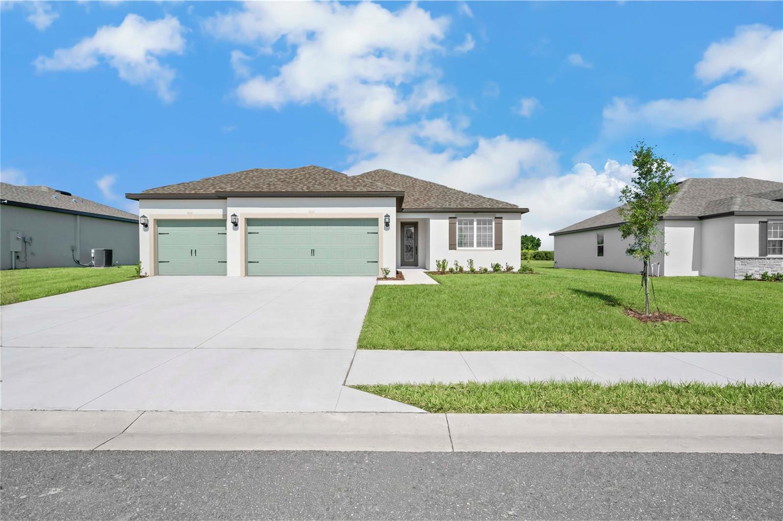 Welcome to the Jensen floor plan, a beautifully designed three-bedroom home that perfectly balances style, space, and functionality in the desirable Citrus Place community. This inviting home features an impressive three-car garage and sits on a premium cul-de-sac lot with no rear neighbors, offering exceptional privacy and a peaceful setting.
The heart of the home is the bright, open living area where the chef-ready kitchen flows effortlessly into the expansive family room. The kitchen shines with abundant counter space, stunning quartz countertops, a stylish subway tile backsplash, white cabinetry accented by matte black fixtures, and premium stainless steel appliances. Just off the kitchen, a charming breakfast nook creates the perfect spot for casual mornings and weeknight dinners, while a separate formal dining room provides an elegant setting for family gatherings and holiday celebrations.
Upstairs, the private master retreat offers a true sanctuary with plenty of room for a king-sized bed, dresser, and cozy reading nook. It features two generous walk-in closets for exceptional storage and a luxurious en-suite bathroom with a dual-sink vanity and linen closet.
Additional thoughtful touches include a convenient upstairs laundry room and a covered back patio that extends your living space outdoors, ideal for relaxing or entertaining.
Elevated Living at No Extra Cost
The Jensen comes with the upgraded CompleteHome Plus™ package, which includes professional landscaping, smart home features, energy-efficient upgrades like double-pane windows and a programmable thermostat, and beautiful modern finishes throughout.
This spacious, family-friendly floor plan is thoughtfully crafted to bring everyone together while still offering private retreats for relaxation. With its premium location in a cul-de-sac and no rear neighbors, the Jensen delivers comfort, style, and lasting value.  Enjoy exceptional value and lower monthly costs with NO CDD fees in this beautiful community!
Ready to make it yours?