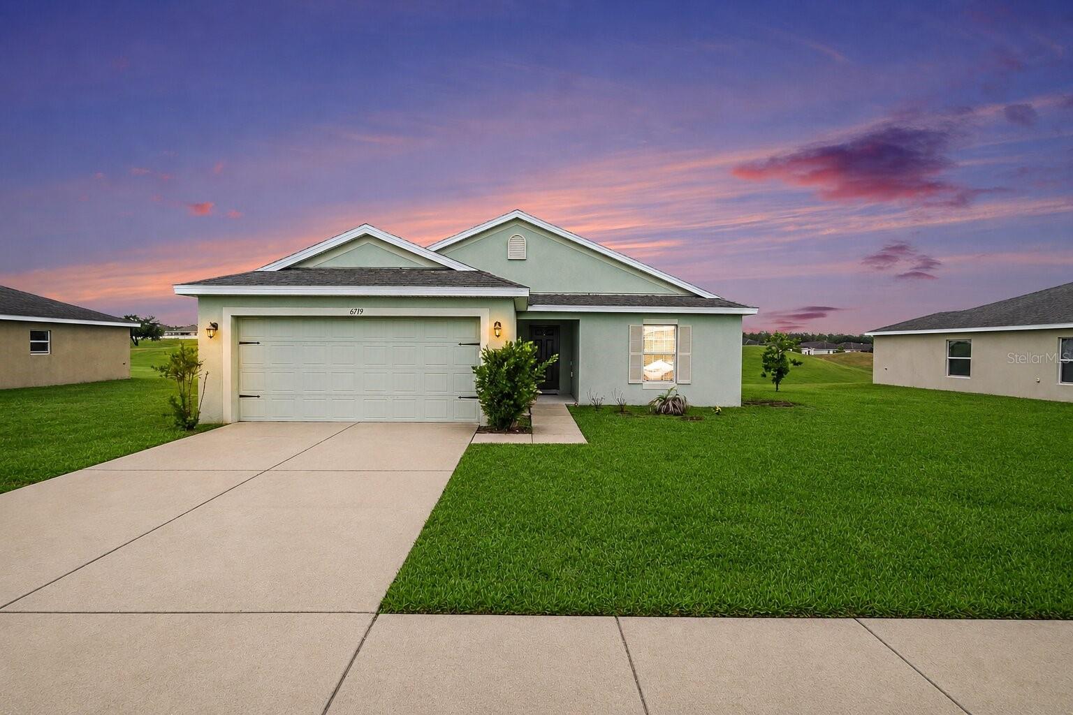 Virtually Staged. Welcome home to 6719 Wirevine Drive! This beautifully maintained 3-bedroom, 2-bath home offers the perfect combination of comfort, functionality, and everyday living. Built in 2017, this move-in-ready home features an inviting open-concept floor plan that seamlessly connects the kitchen, dining, and living areas, creating an ideal space for entertaining family and friends.
The spacious kitchen overlooks the main living area and offers abundant cabinetry, generous counter space, breakfast bar seating, and plenty of room for meal preparation. The split-bedroom layout provides additional privacy for the owner's suite while allowing flexibility for guests, family members, or a home office.

The primary suite offers a spacious retreat complete with an en-suite bath and walk-in closet. Two additional bedrooms provide comfortable accommodations with ample closet space. Neutral finishes throughout make it easy to personalize and move right in.

Step outside to enjoy the backyard with peaceful open views and plenty of space to relax, garden, or entertain. The two-car garage provides additional storage, while the home's newer construction offers peace of mind and low-maintenance living.

Conveniently located with quick access to I-75 and the Suncoast Parkway, commuting to Tampa, Wesley Chapel, Ocala, and surrounding areas is simple. Whether you're a first-time homebuyer, downsizing, or searching for an investment opportunity, this home checks all the boxes.

Schedule your private showing today!