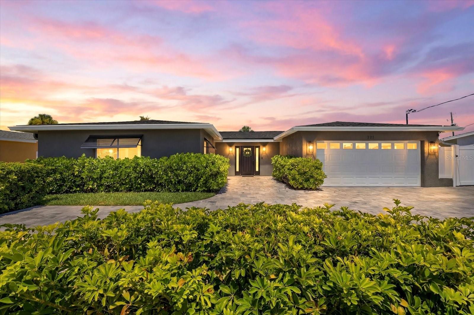 Live the Florida waterfront lifestyle you've been dreaming of! Perfectly positioned in one of St. Petersburg's most desirable boating communities, this beautifully remodeled waterfront residence is just one mile from the sugar-sand beaches of Treasure Island and offers direct Gulf access with no fixed bridges.
Designed for effortless indoor-outdoor living, the open floor plan showcases gorgeous wood flooring and breathtaking views of the sparkling pool and tranquil waterway from the moment you step inside. The chef's kitchen is a showstopper, featuring a Sub-Zero refrigerator, Wolf gas cooktop, Bosch appliances, warming drawer, wine refrigerator, beverage refrigerator, and generous space for gathering with family and friends.
The home offers three spacious bedrooms, including two private ensuite bedrooms, plus a convenient half bath for guests. The luxurious primary suite opens directly to the pool and waterfront through sliding glass doors, creating a peaceful retreat to wake up to every morning.
Step outside to your own private resort. The oversized pool with a relaxing sun shelf invites endless afternoons in the Florida sunshine, while the gas fire pit creates the perfect setting for cool evenings under the stars. Entertain with ease or simply enjoy watching dolphins frolic from your dock.
Boaters will appreciate the private dock with a 10,000-pound boat lift, providing quick, bridge-free access to the Gulf of Mexico for fishing, cruising, or sunset adventures. The oversized garage includes a laundry area with utility sink and three additional refrigerators, offering exceptional storage for entertaining. Roof replaced in 2024, HVAC 2021, All sliders replaced in 2017 with hurricane impact, paver driveway 2021, electric blinds in living room and primary bedroom. Whole house remodel 2024.
Ideally located just minutes from vibrant downtown St. Petersburg, you'll enjoy award-winning restaurants, waterfront parks, boutique shopping, art galleries, museums, live music, sporting events, and year-round festivals. Whether you're spending the day at the beach, boating the Gulf, or dining downtown, this exceptional home offers the very best of Florida waterfront living.
Luxury. Location. Boating. Beaches. This is the lifestyle you've been waiting for.