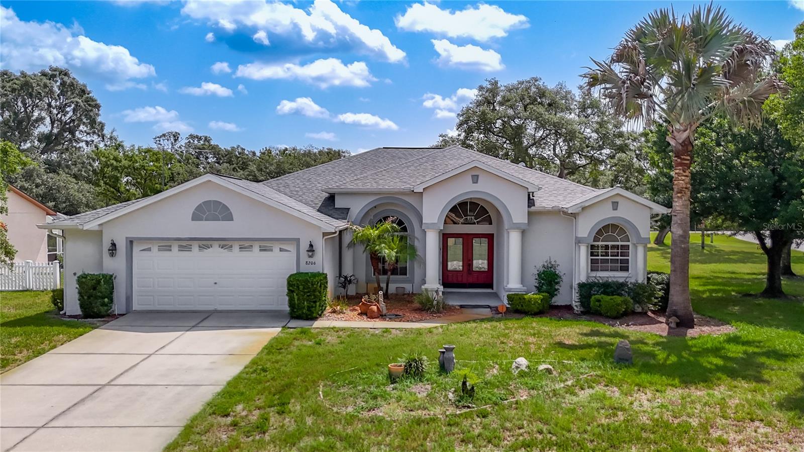 This well-maintained saltwater pool home sits on a spacious .38 corner lot and features 3 bedrooms and 3 full baths. Tucked away on a quiet cul-de-sac at the northern end of Pinehurst Drive, this exceptional Royal Coachman home sits on 1/3-acre corner lot. Step into an inviting open floor plan with cathedral ceilings, designed for both comfort and functionality. The living room/dining room combo features trey ceilings in the living room and sliders to the pool. The eat-in kitchen is a chef’s dream, offering abundant cabinetry, lots of cabinets, Corian counters and opens to the roomy family room with a built-in entertainment center. The primary suite boasts sliding doors leading directly to the sparkling pool, with the master bath featuring dual sinks, double walk-in closets, garden tub and a tiled shower. The second bedroom and third bedroom are generous in size and share a well-appointed bath, ideal for family or guests.  The home also features a spacious third full bath with convenient access from the pool area, adding both comfort and functionality. A dedicated laundry room includes the washer/dryer. Enjoy year-round outdoor living on the expansive screened lanai, and a stunning diamond brite pool—perfect for entertaining or relaxing family gatherings. This exceptional home blends comfort, practicality, and outdoor enjoyment, making it a true retreat. Recent updates include Roof 2022, AC 2026, Vivint security system, and a shed for additional storage. Lots of shopping and favorite local dining options nearby. Close to the Suncoast parkway for quick access to the airport, Tampa, Clearwater and St. Pete Beaches (Ranked in the top 5 Beaches in the US), also close to the famous Tarpon Springs Sponge Docks. It is conveniently located close to restaurants, shopping, schools, and hospitals. It is also conveniently located near Homosassa Springs, Citrus County’s Nature Coast and close to the Gulf to enjoy fishing, boating, Kayaking and so much more.