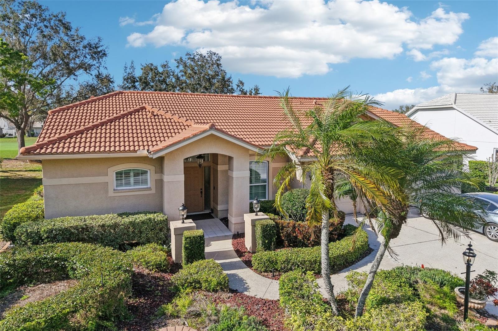 Welcome to your slice of Florida paradise in the highly sought-after Tara Golf & Country Club community in Bradenton. This spacious 4-bedroom, 3-bathroom home offers approximately 2,375 square feet of comfortable living space and sits on a generously sized lot with views of the golf course, perfect for enjoying the Florida lifestyle.  Step inside to discover a bright, open and elegant layout designed for both everyday living and entertaining. The home features multiple living areas, ample natural light, and a functional floor plan that provides plenty of space for family and guests.  The 4th bedroom can be closed off for the ultimate private guest suite.  Outside, relax and unwind in your private screened pool area—ideal for year-round enjoyment, morning coffee, or hosting gatherings with friends and family. The property also includes a spacious attached garage and mature surroundings that enhance its charm and privacy.  Recent improvement include a new roof in 2021, new AC in 2020, tapcon reinforcement and new screens for the lanai enclosure.  Ownership includes a Class “A” membership to Tara Golf & Country Club.  Life at Tara feels like a vacation every day. Enjoy an 18-hole golf course with driving range, putting and chipping greens, plus bocce, pickleball, tennis, and a full fitness center offering yoga, stretch, dance aerobics, and water aerobics. Relax in the resort-style pool and heated spa, or join neighbors for mahjong, bridge, bingo, trivia, Mexican Train, and more.  The clubhouse offers both casual and formal dining, and the full country club membership transfers with ownership, giving you access to the ultimate resort-style lifestyle.  Come enjoy the Florida lifestyle in this beautiful home where comfort, nature, and good company are always part of the day.  Conveniently located near shopping, dining, and major roadways, this home offers the perfect combination of comfort, community, and convenience.  Don’t miss the opportunity to live in one of Bradenton’s most desirable golf communities!