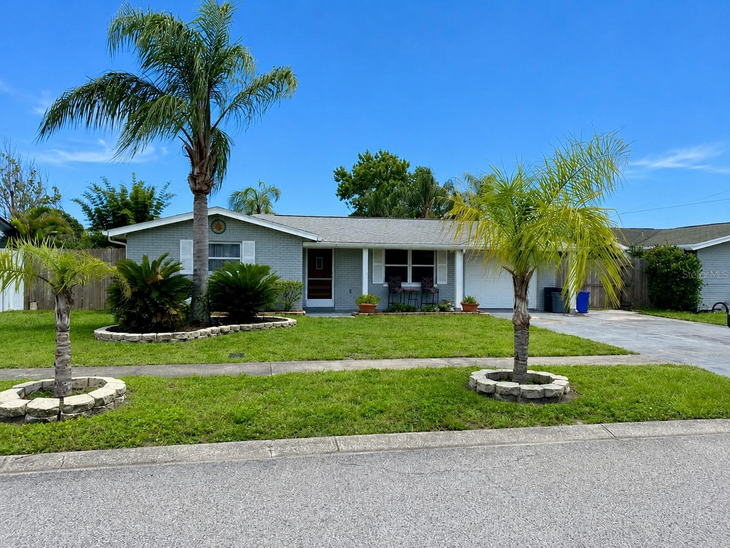 Welcome to affordable Florida waterfront living! 

This beautifully updated 3-bedroom, 1.5-bath home offers the perfect combination of comfort, outdoor lifestyle, and peace of mind — all tucked away on a scenic lakefront setting complete with your own private dock, relaxing backyard retreat, hot tub, and fire pit area overlooking the water.

Step inside to discover fresh interior paint, stainless steel appliances, an inviting layout, and upgrades that help make this home move-in ready. Both bathrooms are conveniently located inside the home, adding comfort and functionality to the layout. Recent improvements include a new water heater, fire-rated rear door, updated rear deck, sprinkler system, and a high-tech security system that does not require a monthly service subscription.

Outside is where this property truly shines. Enjoy morning coffee overlooking the lake, evenings soaking in the hot tub, relaxing around the fire pit, entertaining on the deck, fishing from your private dock, or simply enjoying the Florida lifestyle right from your own backyard.

Additional features include:

Block construction
Fenced yard
Covered outdoor living space
Private dock
Hot tub/spa
Backyard fire pit area
High-tech security system
1-car garage
No HOA
Flood insurance NOT currently required
No sinkhole issues reported

Located in Holiday near the Pasco/Pinellas county line, this home offers convenient access for Tampa Bay commuters while still providing affordable waterfront lifestyle living close to shopping, dining, beaches, parks, and Gulf activities.

Whether you’re searching for your primary residence, seasonal Florida getaway, or simply a home with outdoor charm and lifestyle appeal — this one deserves a look.