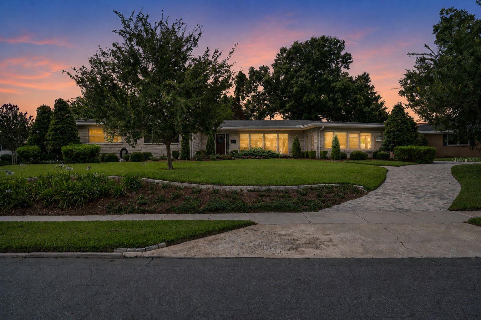 Just steps from Lake Hollingsworth, this beautifully maintained 4 bedroom, 2.5 bath home offers the perfect combination of location, comfort, and thoughtful design. Nestled in one of Central Lakeland’s most sought after areas, you’ll enjoy convenient access to downtown Lakeland, Dixieland, shopping, dining, US 98, and the Polk Parkway.Inside, rich wood flooring flows throughout the home, complemented by custom window blinds and a well appointed kitchen featuring wood cabinetry, quartz countertops, and a stunning marble island. The layout is designed to bring people together, with living spaces that flow naturally to the outdoor entertaining areas.Step outside to a beautifully designed paver patio and pergola surrounded by intentional landscaping and accent lighting, creating an inviting setting for relaxing evenings or hosting guests. Ample parking provides added convenience, while the indoor laundry room and natural gas powered whole house generator offer everyday practicality and peace of mind.Meticulously cared for and thoughtfully updated, this home presents a rare opportunity to enjoy the Lake Hollingsworth lifestyle from a location just moments from the lake’s scenic walking path and some of Lakeland’s most beloved destinations. Don’t miss this opportunity — schedule your private showing today or share this listing with your agent before it’s gone! **Click on the virtual tour button for a Matterport 360 degree immersive walkthrough tour of the home. Just like a 24/7 open house!