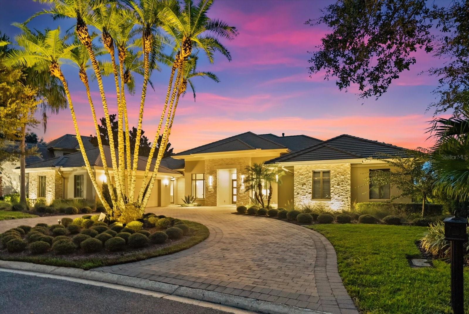 A rare opportunity to reside in Lake Nona's original Estates and own an executive custom home in a world-class golf community. Designed and built by Maroon Fine Homes, this home represents the pinnacle of luxury within the gates of the world-acclaimed Lake Nona Golf and Country Club. Spanning 4,400 square feet under air and 6,400 square feet total, the ranch-style home has been thoughtfully designed for modern family living, effortless entertaining, and timeless elegance overlooking the 12th, 14th and 15th golf holes. The residence offers 5 bedrooms and 4.5 baths, and a prestigious dedicated office. The elegant primary suite has both a spa-inspired bath and a custom walk-in dressing room, with a large, steel floor safe. While the chef's kitchen showcases Thermador stove, microwave and dishwasher appliances with custom Busby soft-close cabinetry, complemented by a walk-in lighted pantry. The door wine refrigerator by Uline provides easy entertaining access from the dining room and summer kitchen. Large laundry room with Whirlpool Duet steam units conveniently located. Expansive open concept living areas, the floor-to-ceiling sliding glass doors connect seamlessly to the grand enclosed 2,000-square-foot colonnade architectural feature screen lanai with beautiful lake and golf course views, overlooking a resort-style backyard with pool, spa, and summer kitchen. A three-car garage with one air-conditioned bay. Anchored by a Tom Fazio-designed championship golf course, Lake Nona Golf and Country Club offers premier tennis, pickleball, fitness, spa, fine dining, kids club and 24-hour security. In 2025, a new fitness center will debut, followed by a remodeled clubhouse, new resort pool and new dining venues in 2026, further enhancing Lake Nona's standing as Central Florida's most prestigious private club community. 24-hour gated security is included in the HOA of $2,170 per quarter.