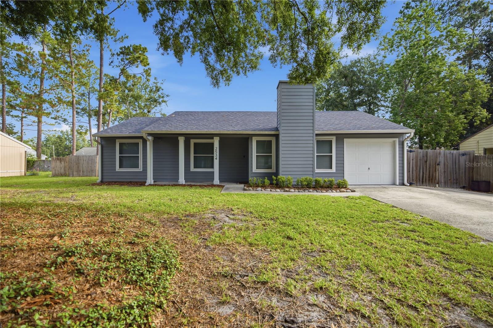 Virtually Staged. *SOME PHOTOS ARE VIRTUALLY STAGED*. This well-maintained 3-bedroom, 2-bath home is located in the desirable Springtree neighborhood of Northwest Gainesville. Situated on a quiet cul-de-sac street with no through traffic, this property offers a private setting while remaining convenient to Santa Fe College, the University of Florida, area hospitals, shopping, dining, and downtown Gainesville.

Major improvements have already been completed, including a NEW ROOF (2024), Hardie Board siding (2021), gutters (2021), updated windows (2016 & 2021), HVAC system (2016), gas water heater (2022), fresh paint inside (2026), and recently updated tubs and showers (2026) after the toilets and vanities were replaced (2020). The kitchen features stainless steel appliances and a gas range. Also, the insulated one-car garage is equipped with air conditioning, providing flexible space for hobbies, storage, or a workshop.

The fully fenced backyard offers privacy and room to enjoy the outdoors, and the irrigation system helps keep the property looking its best. With significant updates already completed and room for a new owner to add their own cosmetic touches, this home presents an excellent opportunity in one of Northwest Gainesville's most established neighborhoods.