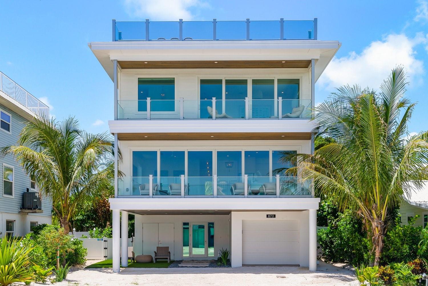 LOCATION!!!! North Shore Drive, one of the most popular streets in Anna Maria! This is a gorgeous custom built home with panoramic views of the Bay. 4 bedroom, 4 and a half baths enjoy the spacious layout with high ceilings and views of the Bay from almost ever window! Enjoy the expansive balconies on each floor, looking out onto the beautiful water where you’ll see dolphins playing and jumping. At night, directly across the way you’ll see the Skyway Bridge light up with all different color lights. Elevator and 2 car garage with plenty of parking out front as well. The backyard will be where you spend all your time. Relax on the bay beach or hang in the heated pool and spa surrounded by lush landscaping and very private. Ideal location so close to Pine Ave, just a short stroll away. Schedule your private showing today!