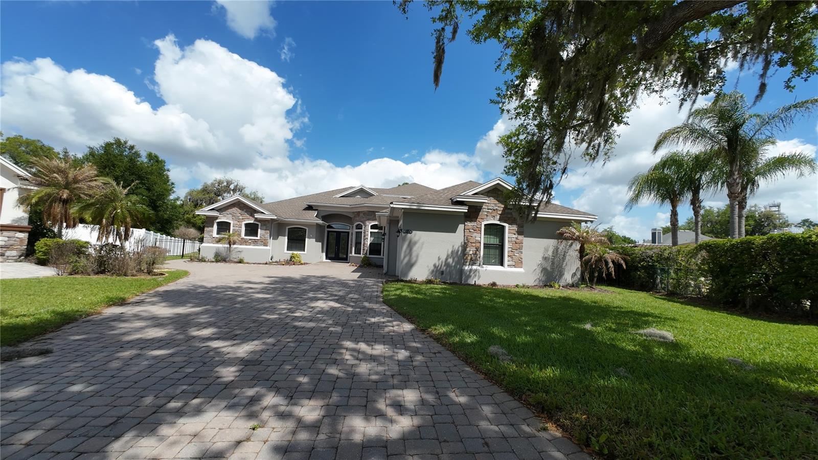 Luxury Citrus Legacy Estate | Exclusive Gated Community Experience the perfect harmony of refined elegance and unparalleled functionality in this magnificent custom estate. Spanning an expansive floor plan, this 5-bedroom, 4.5-bathroom with a huge flex room residence is a masterpiece of design. Located in the heart of Lakeland, Florida, this home sits on land once defined by the region's legendary citrus heritage. Now, it stands as the centerpiece of an ultra-exclusive, gated enclave of only ten residences, offering the ultimate in privacy and prestige. The Ultimate Indoor-Outdoor Lifestyle This home is a true entertainer's dream, anchored by a massive, professionally designed lanai that perfectly captures the Florida lifestyle. The outdoor living space features a complete outdoor kitchen equipped with a premium built-in gas grill, creating the perfect setting for seamless year-round hosting. Beyond the kitchen, indulge in your own private resort with a sparkling saltwater pool and spa. Gourmet Culinary Sanctuary At the heart of the home lies a professional grade gourmet kitchen, designed for the serious chef. Featuring high-end appliances, custom cabinetry, and a suite of ''whole gas'' features--including a high-performance gas stove--this space is as functional as it is beautiful. Premium Gas & Smart Infrastructure Built for those who value efficiency and peace of mind, this home features: A whole-house generator provides complete reliability, while three dedicated HVAC units give precision zoned climate control. Gas-Powered Luxury: A ''whole gas'' residence featuring a tankless water heater for endless hot water, a gas stove, and a dedicated gas hook-up for the laundry suite. Architectural Grandeur: Impressive, soaring front entry doors and expansive sliding glass walls that create a seamless, light-filled flow between the great room and the sprawling outdoor space. Garage & Storage: A massive, oversized garage designed to accommodate large vehicles, storage, and projects with ease. Prime Lakeland Living Positioned minutes from the area's finest attractions, you are never far from the action. Enjoy quick access to the vibrant culture of Florida Southern College, entertainment at the RP Funding Center, and spring training at Joker Marchant Stadium. For nature lovers, the serene trails of Circle B Bar Reserve and the iconic Bok Tower Gardens are just a short drive away. Discover the lifestyle you deserve. This rare property represents the absolute best of Lakeland living. Schedule your private tour today to experience the grand scale and exquisite craftsmanship of this estate in person.