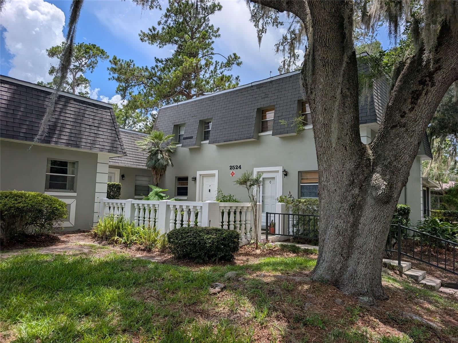 Recently updated with new paint and new plank vinyl flooring. Townhouse unit with both bedrooms upstairs. Full bath upstairs and half bath downstairs for guests. This unit has a covered and screened rear patio. New AC/Heat in 2023.
