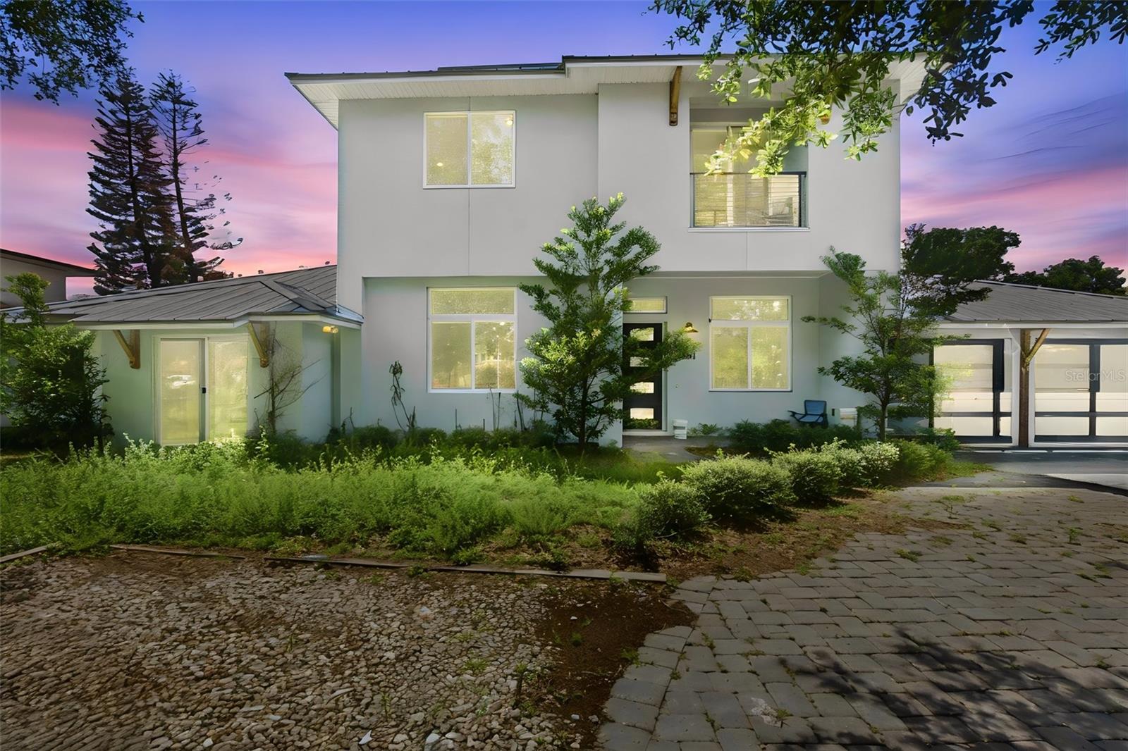 Short Sale. Welcome to this luxury, home in the heart of Winter Park. Less than a mile away from Park Ave. Winter Park that offers entertainment, restaurants, farmers market and so much more. A beautiful contemporary style home with modern interior finishes. Featuring an open floor plan, 5 bedrooms, 4.5 baths, a loft/flex space, media room, 2 study areas, front porch, back patio, lanai and so much more. Corner lot and privacy. Engineered hard wood floors through out the house and tile in utility rooms. 2 laundry rooms for convenience, located on 1st and 2nd floor of the home. Private backyard setting, a very large pool, an outdoor entertainment area featuring a kitchen and a fireplace and a screened in lanai. Metal Roof with Solar panels. A gas stove with large island and lots of space for entertainment. This home has a lot to offer in the most desirable location. Schedule your showing today.