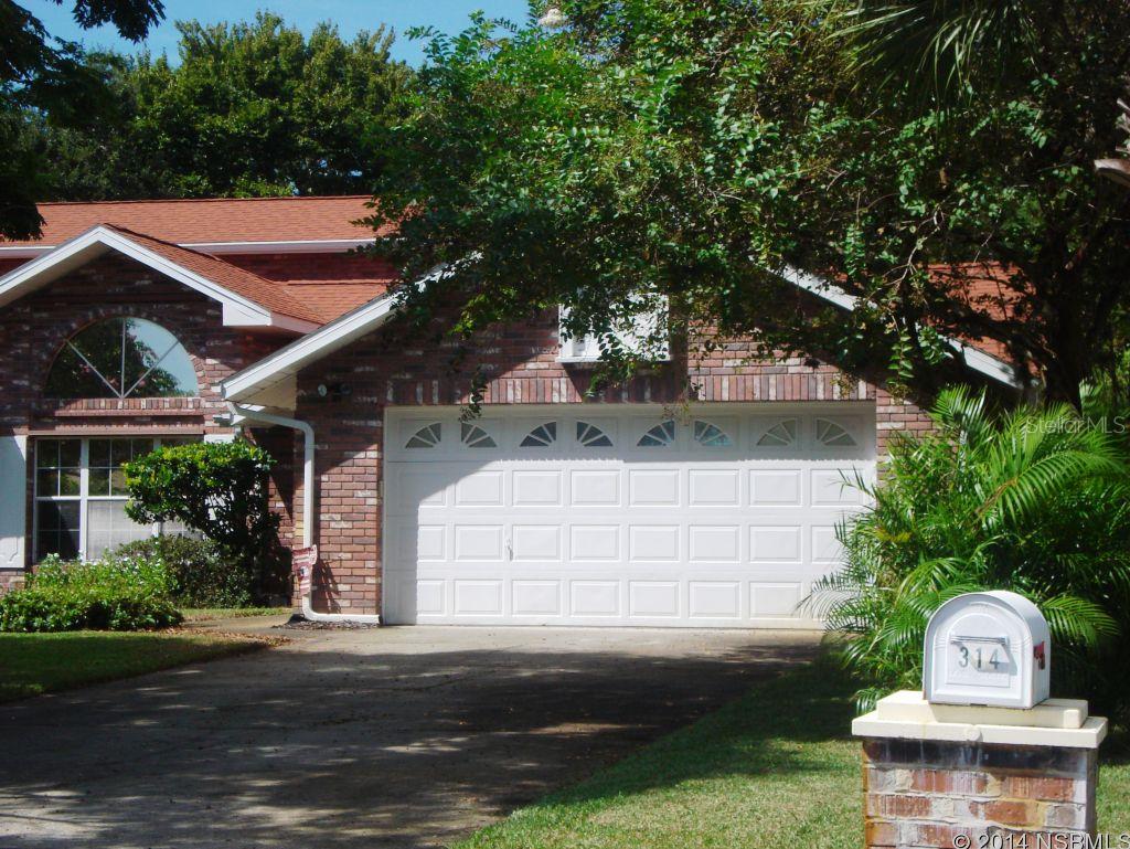 MOVE-IN READY. BIG AND BEAUTIFUL! THIS 4 BEDROOM HOME HAS THREE (3) BEDROOMS DOWN AND TWO  LARGE ROOMS  UPSTAIRS THAT COULD BE TWO BEDROOMS OR A BEDROOM AND STUDY. LARGE KITCHEN WITH PLENTY OF COUNTER SPACE AND CABINETS. EAT-IN KITCHEN AND A SEPARATE DINING ROOM FOR ENTERTAINING GUESTS AND BIG FAMILIES. THE BEDROOMS ARE SPACIOUS WITH LARGE CLOSETS. THE SPLIT BEDROOM PLAN ALLOWS FOR PRIVACY FOR EVERYONE. THERE IS A GLASS AND SCREENED FLORIDA ROOM THAT HAS VIEWS OF THE LAKE AND THE LARGE TROPICAL BACK YARD THAT STAYS LOOKING GREEN AND LUSH WITH THE INGROUND SPRINKLER SYSTEM. THE HOME IS TILED THROUGHOUT THE MAIN AREAS AND ALL BEDROOMS ARE CARPETED. NATURAL GAS HEAT, WATER HEATER AND CLOTHES DRYER WITH AVAILABLE HOOKUP FOR A GAS STOVE IN THE KITCHEN. THE HOME COMES EQUIPED WITH HURRICANE SHUTTERS AND A REINFORCED GARAGE DOOR WITH OPENER. THE NEWER HVAC SYSTEM AND ROOF ALONG WITH R30 INSULATION MAKE THE UTILITIES VERY LOW. THE PROPERTY BACKS UP TO A GREEN SPACE AND A LARGE LAKE. CLOSE TO SHOPPING AND SCHOOLS BUT FEELS LIKE THE COUNTRY. OWNER RELOCATING. DON'T MISS THIS LARGE FAMILY HOME. ;Water: City