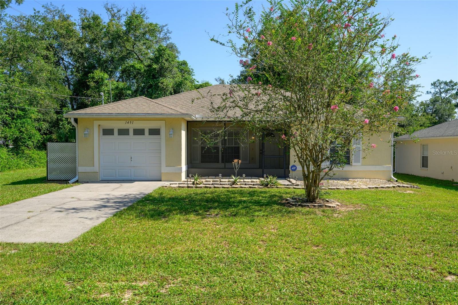 Just Listed in Orange City!  This immaculate three-bedroom, two-bath home is move-in ready and packed with charm.  Situated on a corner lot with a fully fenced backyard, it features a bright open-concept kitchen with breakfast bar, slider to a large patio, and a split floor plan with an upgraded master bath with tub. There is an inside laundry room and one car garage with electric door.  Enjoy screened porches front and back, plus the convenience of a paved street location in the popular Highlands neighborhood. There is no HOA!  Close to Blue Springs State Park, shopping and easy access to 1-4.  Don't miss this one-come see it before it is gone! 
ADT security system active and leased, ask agent for more information.
*All information to be verified by Buyer and Buyers agent including descriptions, measurements, dimensions and zoning.