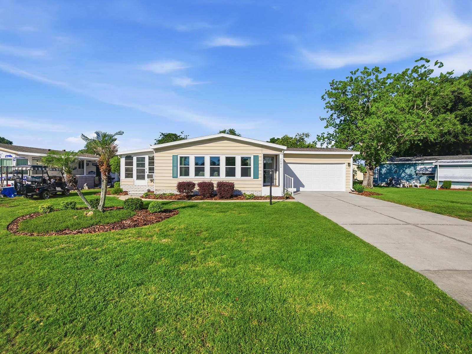 Beautiful sunny home located in the award-winning golf community of The Plantation at Leesburg! This lovingly maintained 2-bedroom, 2-bath home offers a bright and open floor plan perfect for comfortable Florida living. The beautifully updated kitchen features ample counter space, abundant storage, and a charming dinette area ideal for casual dining.

The spacious living room flows seamlessly into the dining area and kitchen, creating an inviting atmosphere for entertaining family and friends. The owner’s suite includes a private en-suite bathroom, while the guest bedroom, guest bath, and versatile den are all tastefully decorated and move-in ready.

A rare 2-car garage provides plenty of storage and protection for your vehicles. Relax year-round in the cozy Florida Room, the perfect spot to unwind and enjoy the sunshine. Major updates include a new roof (2015) and A/C (2018). Home comes Partially furnished. 

The Plantation at Leesburg offers an incredible resort-style lifestyle with 3 swimming pools, 2 golf courses, walking trails, 3 clubhouses, tennis courts, pickleball, horseshoes, softball, 2 fitness centers, and endless social activities. Hop on your golf cart and head to the neighborhood favorite, Steve’s Bar & Grill, for great food, live music, karaoke, and fun with friends. Don’t forget to stop by the Pro Shop connected to the restaurant before or after your round of golf.

Come experience the fun, active lifestyle and welcoming community of The Plantation at Leesburg!