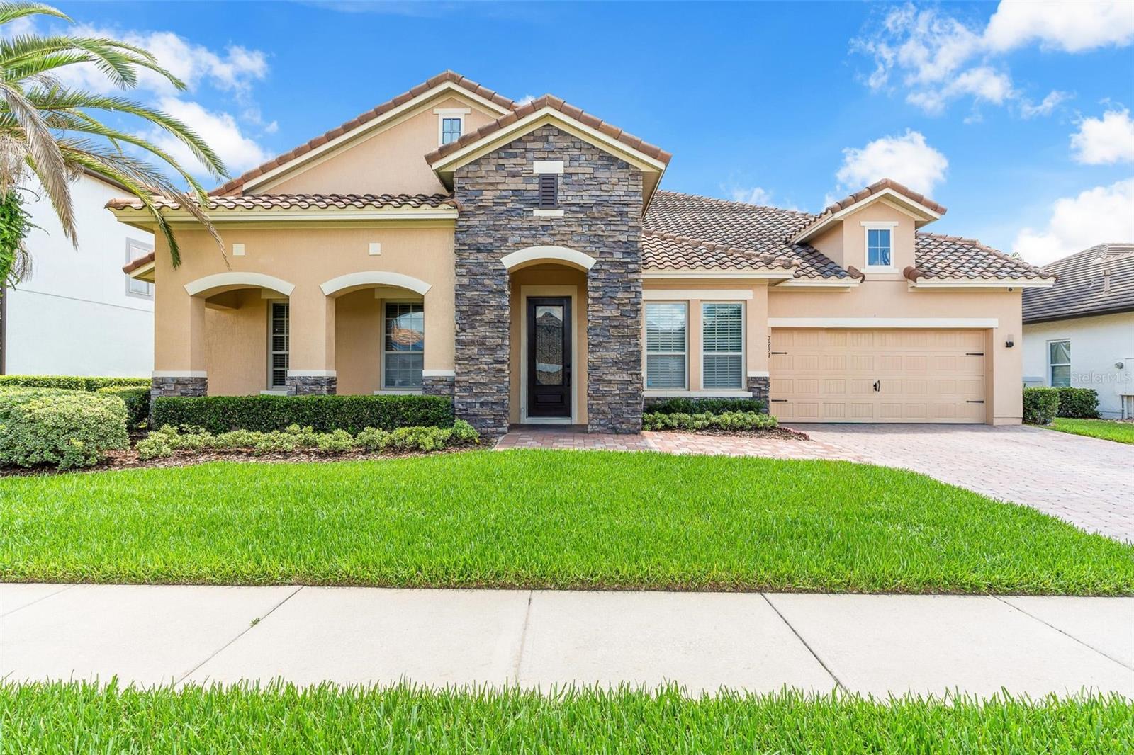 Tucked away within the private gates of Casa Del Lago, one of Windermere’s most desirable communities, this exceptional home offers a rare opportunity to enjoy luxury living just moments from everything Central Florida has to offer. With only 88 residences surrounding the shores of Lake Burden, Casa Del Lago provides an intimate neighborhood setting close to top-performing schools, major roadways, Orlando International Airport, upscale shopping, dining, and the area’s famous attractions.
Crafted by renowned builder David Weekley Homes, this impressive residence spans almost 4,000 square feet and has been designed with both comfort and functionality in mind. The main level features four generously sized bedrooms, including a unique wing where two bedrooms are connected by a versatile flex space, perfect as a playroom, study area, or media room. Each bedroom benefits from its own private bathroom, providing comfort and privacy for family members and guests alike.
The heart of the home is the open-concept living area, complemented by a dedicated office for remote work and a formal dining room for special occasions. A conveniently located pool bath provides easy access from both the interior living spaces and outdoor entertaining areas.
Upstairs, you’ll find an expansive bonus room that can serve as a game room, home theater, fitness space, or second living area. Also on this level is a private guest suite complete with its own full bathroom, ideal for visitors, older children, or extended family.
Step outside to your own backyard oasis where a screened swimming pool, oversized paver deck which could be a great basketball or play area, and maintenance-free turf create the perfect environment for relaxing or entertaining throughout the year. For added convenience and security, the home is equipped with an extensive CCTV system featuring 21 cameras.
Residents of Casa Del Lago also have the option to join the nearby Golden Bear Club at Keene’s Pointe, offering championship golf, dining, social events, and premium recreational amenities. With homes in this sought-after community seldom available, this is a chance to secure a property in one of Windermere’s most coveted gated neighborhoods.