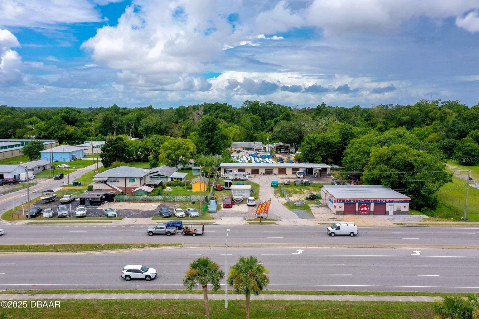 We are pleased to present a multi-parcel offering featuring two parcels with a total of 12 distinct income streams. The diverse tenant base includes a well-established motorcycle repair business with laydown space, a used auto sales operation, an outbuilding with yard space, an 8-unit warehouse building, and a two-story duplex. The property is currently 100% occupied. Significant capital improvements have been made within the last two years, including the replacement of roofs on three major buildings and upgrades to all three septic tanks and their associated leech fields. All major maintenance items have been addressed, making this an ideal opportunity for a 1031 exchange or redevelopment. The property is located in an unincorporated area and benefits from B-5 zoning.