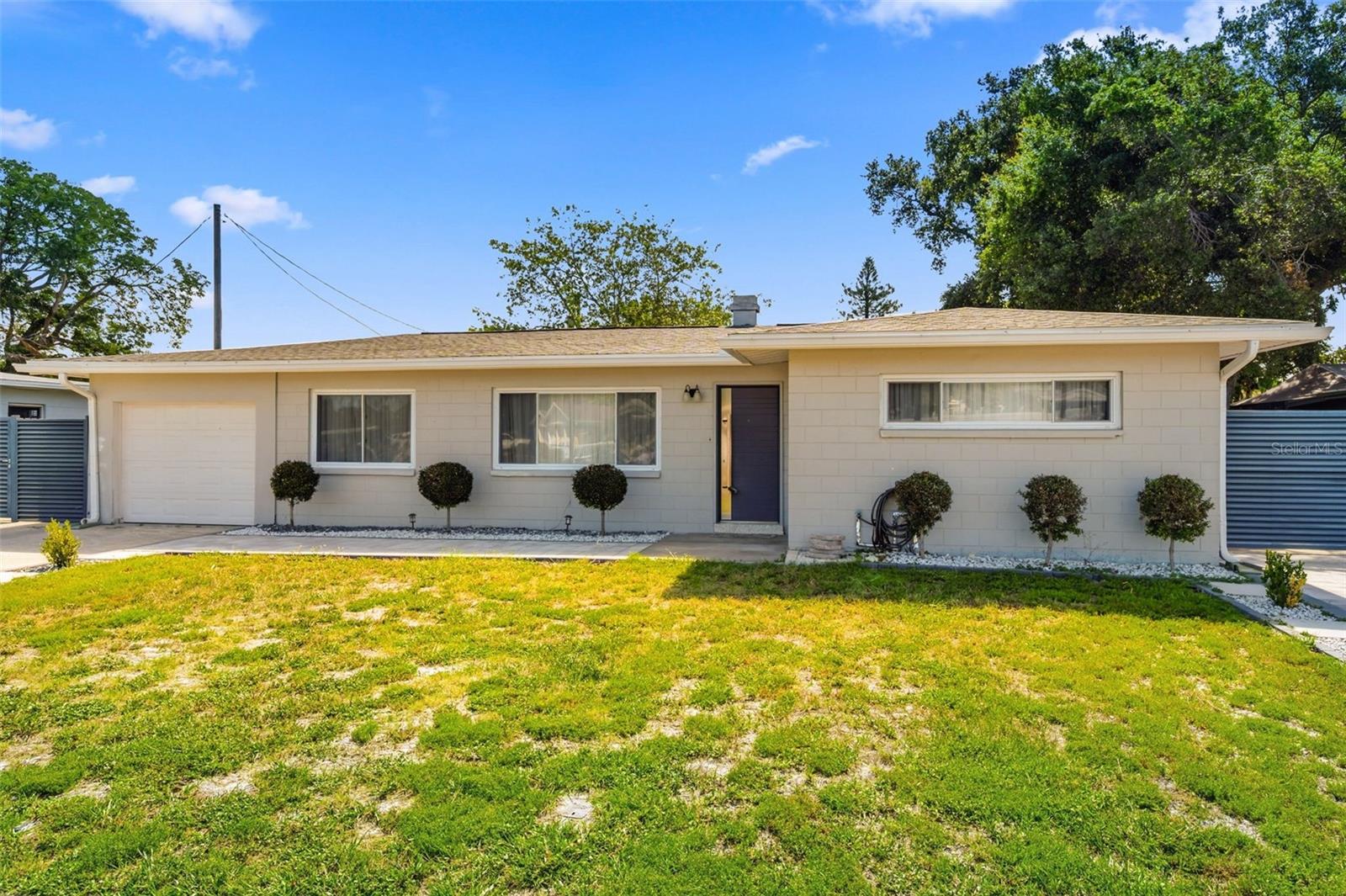 Completely RENOVATED and move-in ready, this exceptional Clearwater property WITH ITS OWN ADDITIONAL GUEST HOUSE showcases over $150,000 in recent UPGRADES, including a designer kitchen, beautifully remodeled bathrooms, new flooring, interior paint, custom doors, updated windows, new fencing and gates, and extensive outdoor improvements. A standout feature is the fully renovated detached GUEST HOUSE featuring its own bedroom, living room, kitchen, bathroom, and separate utilities, making it perfect for extended family, guests, or as an income-producing rental opportunity. Additional highlights include a CUSTOM BUILT SAUNA, spacious outdoor living areas, and a versatile layout that combines luxury, comfort, and outstanding investment potential.