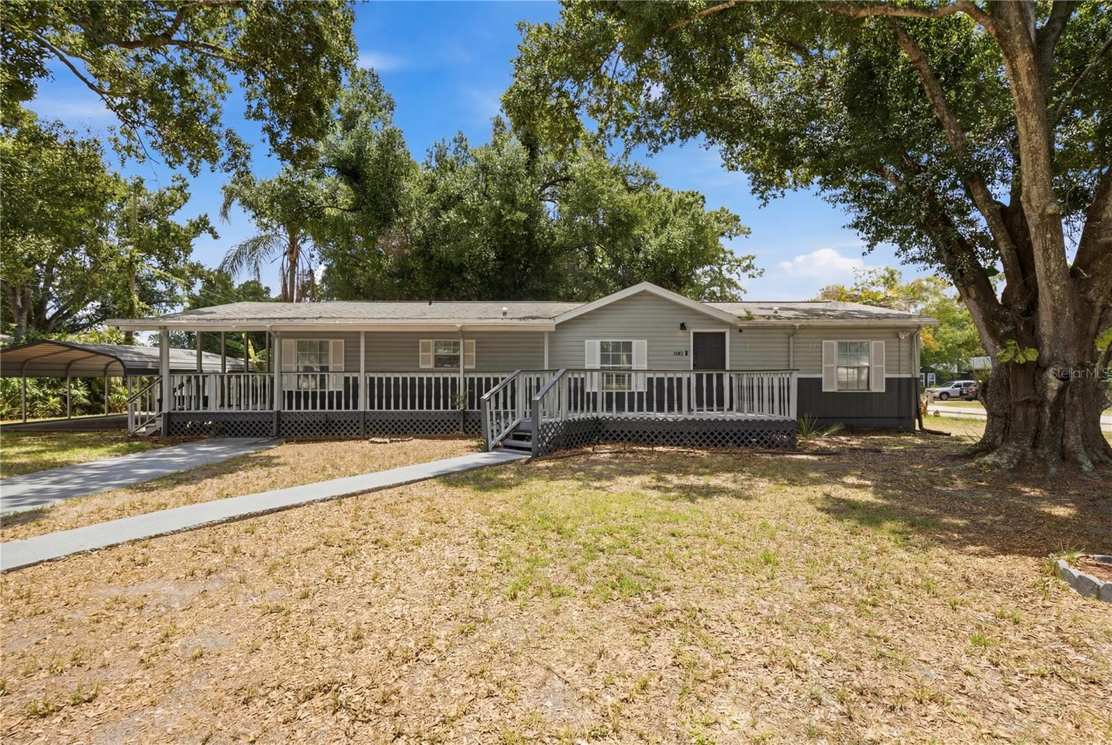 SHADE. SPACE. SERENITY. Welcome home to this beautifully updated residence situated on an oversized corner lot in the heart of Tampa. Nestled beneath majestic oak trees, this property offers the perfect blend of modern updates, generous living space, and timeless curb appeal.

Step inside to discover a bright and inviting floor plan featuring NEW luxury vinyl plank flooring, neutral designer finishes, and spacious living and dining areas ideal for everyday living and entertaining. The renovated kitchen showcases white shaker cabinetry, stainless steel appliances, quartz-style countertops, and a striking designer backsplash that adds both character and style.

The spacious primary suite provides a comfortable retreat, while the additional bedrooms with great closet spaces offer flexibility for family, guests, a home office, or hobbies. Outside, you'll love relaxing on the expansive covered front porch overlooking the beautifully shaded yard—perfect for morning coffee, evening conversations, or simply enjoying Florida's year-round sunshine.

Conveniently located near downtown Tampa, major highways, shopping, dining, parks, and schools, this move-in-ready home offers the space, updates, and location today's buyers are searching for.

Don't miss your opportunity to own this Tampa gem—schedule your private showing today!