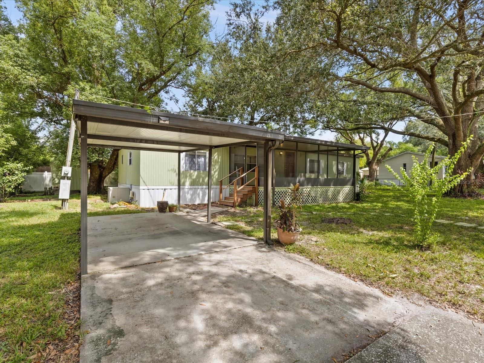 Come enjoy Florida sunsets from your own front porch in your brand new home that has NEW flooring in the kitchen and utility room! This well maintained manufactured home has 4 spacious bedrooms and 2 bathrooms. This house offers a split floor-plan and plenty of living space that everyone will enjoy. The roof is less than 5 years old and the A/C blows nice and cold. The master bedroom has its own private bathroom that was recently updated. Outside you will find a covered deck, perfect for entertaining or relaxing with friends and family. No HOA! There is a shed for storage and plenty of room for all of your toys. You will be minutes away from downtown Tampa and have easy access to I-4 and I-75. Come see what a great place this would be to call home!