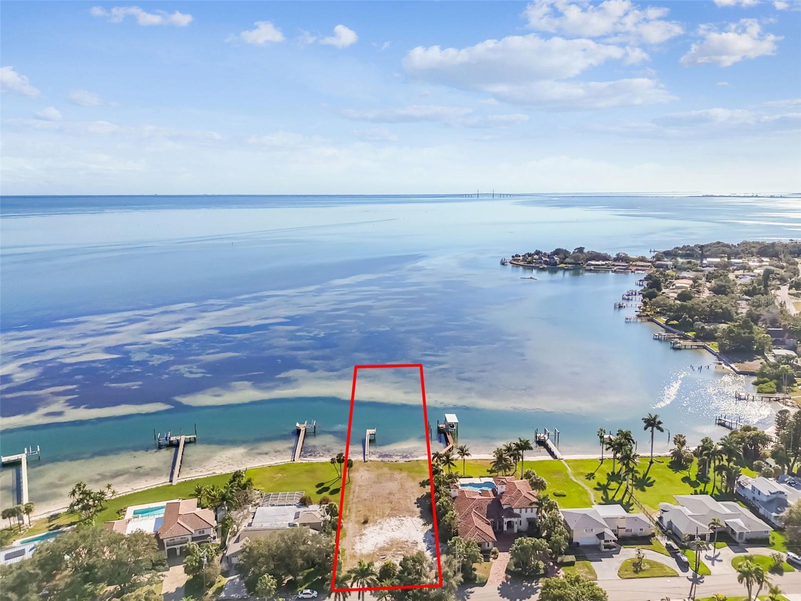 1.49-ACRE WATERFRONT MASTERPIECE in BAHAMA SHORES, ST PETE. – Construction Plans Included
This expansive 1.49-acre lot on Bahama Shores Drive presents a rare, shovel-ready opportunity to build a premier coastal estate on the open waters of Tampa Bay. With the previous structure cleared and a comprehensive set of modern-contemporary architectural plans already in hand, the most complex stages of development are complete, allowing for an immediate transition into construction.
* Oversized Estate Lot: 
Spanning nearly an acre and a half with 100 feet of direct water frontage and a depth of 200 feet, this property offers a level of scale and privacy that is increasingly difficult to find in St. Petersburg. The generous lot size provides ample room for the proposed contemporary residence while maintaining significant outdoor space for custom landscaping, sprawling lawns, or additional waterfront amenities.
Architectural Vision & Elevated Design
The included plans detail a sophisticated one-story contemporary residence meticulously designed for this specific site. To ensure longevity and modern compliance, the design features a specialized flood vent plan. This engineered approach raises the finished floor elevation above the flood plain while maintaining the sleek, accessible, and high-ceiling profile of a modern single-story home, allowing for discounted flood insurance.
* Unrivaled Views & Deep Water Infrastructure:
Positioned to capture panoramic, unobstructed views of Tampa Bay, the property offers a front-row seat to the region's most iconic vistas.
* Sunshine Skyway Views: Enjoy a dramatic, direct line of sight to the Sunshine Skyway Bridge—a breathtaking backdrop for sunsets and evening lights.
* Existing Deep-Water Dock: 
The property features an existing private dock, providing immediate deep-water access for large vessels with no fixed bridges to the Gulf. Ownership vs. Riparian Rights
While most Florida waterfront owners only own to the Mean High Water Line (MHWL) and have "riparian rights" to build a dock, the public record for this specific address shows a 1.49-acre lot.
Submerged Land Ownership: The legal description indicates the property line extends approximately 200 feet deep into the bay, covering roughly 65,113 square feet of total area, without the need for a submerged land lease.

The "Gap" Advantage: Unlike neighbors who may need to lease sovereign submerged land from the State of Florida to build long docks, your boundary likely encompasses the seabed itself, simplifying the control you have over the submerged portion of your lot.
* Premier Location: 
Nestled in the prestigious Bahama Shores neighborhood, you are just 10 minutes from the cultural and dining scene of Downtown St. Petersburg and 15 minutes from the world-class beaches of St. Pete Beach, 20 minutes to St. Pete/Clearwater Airport (PIE), 27 minutes to Tampa International Airport (TPA), 
** Skip the years of architectural design and permitting hurdles. With a 1.49-acre canvas and a full set of plans ready for execution, you can begin building your legacy waterfront estate today. **