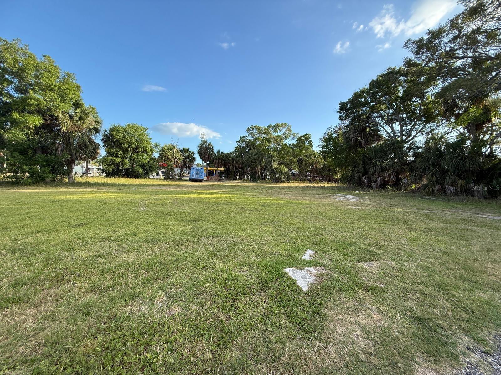 Water view of Big Bayou and quick water access from this vacant buildable lot. Multi-story home or homes, multiple town homes, or multi-family can be developed on this land.
Versatile zoning offers many options to realize a worthwhile return on your investment. Four to six units total are possible on this lot as condos, apartments, or town homes pending whether it is developed as purely market rate units, workforce/attainable units, or a mixture. A partial water view is possible from second floor, third floor, and/or a walkout rooftop deck. You can also build a sizeable primary home or design with the intent to “house hack.” This neighborhood is transitioning in value rapidly! It is your responsibility to confirm all of what this zoning allows with The City of St. Petersburg zoning department.
