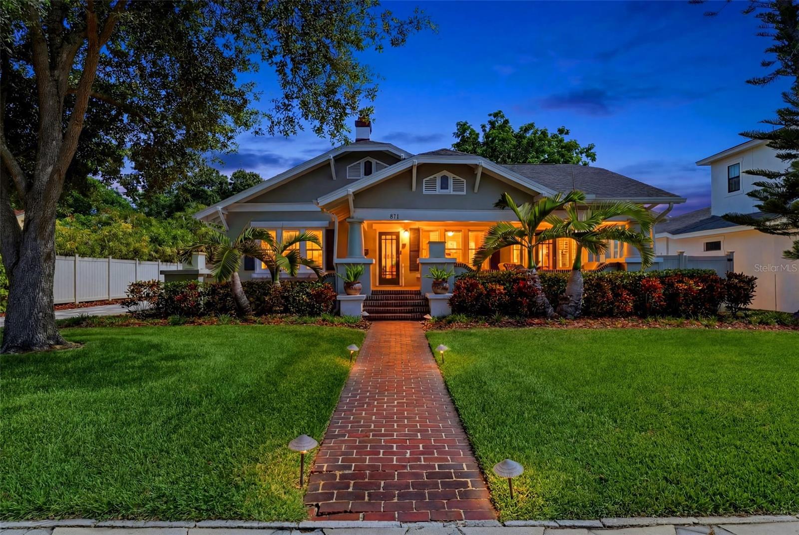 Perfectly positioned just two blocks from Crescent Lake Park, this charming and beautifully maintained 1920s bungalow offers the rare combination of historic character, modern updates, and exceptional income-producing potential in one of St. Petersburg's most sought-after neighborhoods.
The property features a thoughtfully updated 2-bedroom, 2-bath main residence with over 1,500 square feet of living space, along with a fully equipped detached 1-bedroom, 1-bath accessory dwelling unit (ADU) offering approximately 650 square feet. Whether used for rental income, multigenerational living, a private guest retreat, or home office, the ADU provides incredible flexibility and value.
The main home is filled with timeless charm, featuring original hardwood floors, a wood-burning fireplace, abundant natural light, and a spacious dining room highlighted by original tile flooring and walls of windows. The modern open-concept kitchen is equipped with stainless steel appliances and flows seamlessly into the home's inviting living spaces. Additional highlights include an indoor laundry room with ample storage, a large covered front porch spanning the full width of the home, and a wraparound rear porch overlooking the backyard with new decking and a newly installed paver patio—perfect for outdoor entertaining.
Outside, you'll find a new, large paver driveway for off-street parking, well-fed irrigation, landscape lighting, and mature landscaping that enhances the property's curb appeal.
The detached ADU offers its own private alley access, dedicated parking, separate entrance, screened porch, full kitchen, loft-style bedroom, and two independent HVAC systems, including a ductless mini-split, creating a comfortable and private living experience.
Steps from Crescent Lake, locals enjoy the walking trails, green space, dog park, tennis courts, pickleball courts, and lakefront playground. 
Located just minutes from vibrant downtown St. Petersburg, and the bustling 9th & 4th Street corridor, waterfront parks, restaurants, shopping, and entertainment, this move-in-ready property presents a rare opportunity to own a character-filled home with immediate income potential in the heart of Crescent Lake. No flood insurance required.