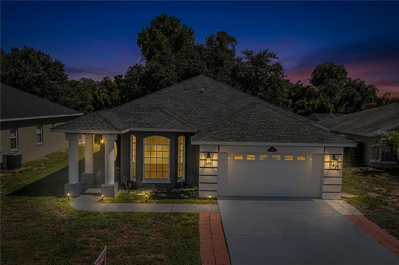 Experience country living at its finest with this beautiful home offering a spacious, inviting floor plan and peaceful wooded surroundings. Step through the elegant double entry doors with glass-pane windows into a welcoming foyer accented by beautiful lighting. Decorative columns lead you into the spacious kitchen featuring granite countertops, abundant cabinetry, a center island, and a charming breakfast nook.

The open-concept design allows the kitchen to flow seamlessly into the dining and living areas, making this home ideal for both everyday living and entertaining. Tile flooring extends throughout the main living areas, while large sliding glass doors fill the living room with natural light and open to the spacious back lanai. Relax and enjoy the peaceful views of the wooded surroundings, offering a wonderful sense of privacy and tranquility.

The spacious primary suite features its own sliding glass doors leading directly to the back lanai, creating the perfect place to enjoy your morning coffee or unwind at the end of the day. The primary bath offers a large garden tub, separate walk-in shower, and generous walk-in closet. Two additional bedrooms provide plenty of space for family, guests, or a home office.

A large laundry room offers additional convenience with direct access to the garage. Centrally located in the heart of Central Florida with convenient access to major highways, shopping, dining, and world-famous theme parks, this property offers the perfect combination of peaceful country living and accessibility. Come experience all this beautiful property has to offer and schedule your private showing today!