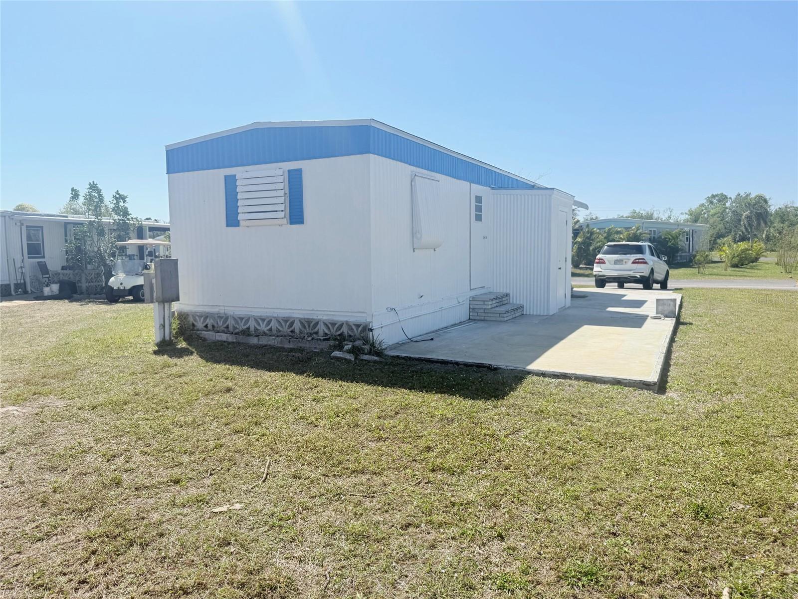 Welcome to easy Florida living in the desirable Village of Holiday Lakes! This charming 1-bedroom, 1-bath manufactured home offers a comfortable and affordable lifestyle in a friendly, active community. The home features an inviting living area, a functional kitchen with ample cabinet space, and a bedroom designed for relaxation. The interior provides a cozy atmosphere, while the outdoor space offers the perfect spot to enjoy your morning coffee or evening breeze. Whether you're looking for a seasonal retreat, year-round residence, or investment opportunity, this home delivers exceptional value. Residents of Holiday Lakes enjoy access to community amenities, social activities, and a convenient location close to shopping, dining, golf courses, boating, and Florida's beautiful Gulf Coast beaches. Don't miss this opportunity to own your own piece of paradise in Holiday Lakes!