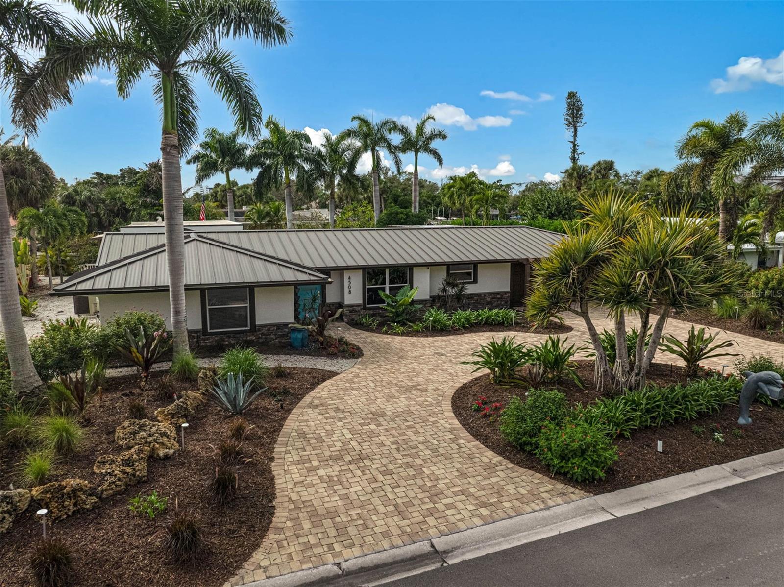 The Fastest Open-Water Access Available on Siesta Key Under $2.5 Million
Less than 3 minutes to Sarasota Bay, 95 feet of waterfront, and a 75-foot dock designed for serious boating enthusiasts. If you’ve been searching for a waterfront home that prioritizes boating convenience over lengthy canal runs, this is one of the most compelling opportunities currently available on Siesta Key.
Why spend 30–45 minutes idling through canals when you can be in Sarasota Bay in under 3 minutes?
Positioned on one of Siesta Key’s premier deep-water canals, this exceptional waterfront residence offers the rare combination of protected dockage and near-immediate access to open water. For boaters who value time on the water, this location is difficult to replicate at any price point.
Designed with larger vessels in mind, the property features approximately 95 feet of waterfront, a 75-foot dock, 200-amp dock service, and four 50-amp shore power connections. Whether you’re heading offshore, cruising the Intracoastal, or enjoying a sunset cruise across Sarasota Bay, this home delivers a level of boating convenience that few waterfront properties can match.
Boater Highlights?• Less than 3 minutes to Sarasota Bay?• Approximately 95 feet of waterfront?• 75-foot dock?• Four 50-amp shore power connections?• 200-amp dock service?• Deep-water canal location?• Protected dockage with quick open-water access
Inside, the home has been thoughtfully renovated with a clean coastal-modern design featuring designer tile flooring, an open-concept floor plan, Viking gas appliances, custom cabinetry, and expansive waterfront views. The spacious living areas flow seamlessly into the kitchen and entertaining spaces, creating an ideal environment for both everyday living and hosting guests.
The private primary suite serves as a luxurious retreat, complete with an oversized walk-in closet, spa-inspired bathroom, glass-enclosed shower, and direct outdoor access. An additional flexible space offers the opportunity to create a fourth bedroom, private guest suite, office, or media room.
Outdoor living is centered around the waterfront lifestyle. Enjoy a saltwater pool and spa, tropical landscaping, integrated lighting, retractable awning, propane fire pit, outdoor shower, and multiple seating and entertaining areas overlooking the canal.
Additional features include a 13.5 kW generator, hurricane protection, epoxy-finished garage, updated HVAC system, newer water heater with circulation system, 250-gallon propane tank, and valuable dry storage space.
Originally introduced at $2,690,000 and now offered at $2,450,000, this property represents one of the strongest values currently available for buyers seeking deep-water dockage, exceptional boating access, and luxury waterfront living on Siesta Key.
Luxury yacht available separately.