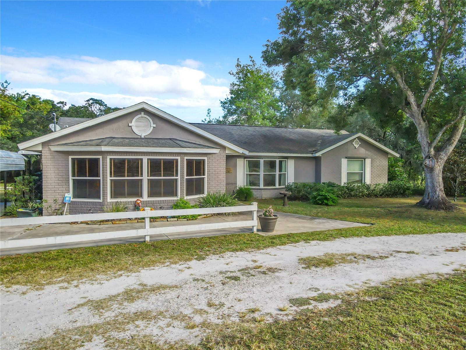 Nice find in a quiet and lovely part of Debary, highly sought after property in Orlandia Heights with over and acre of heaven. Come see this lovely 3/2 home with additional flex space in an enclosed garage with beautiful built ins and an oversized walk-in pantry! This home boasts a split plan for master privacy as well as a very large eat in kitchen.  The living area is very spacious and has vaulted ceilings.  Beautiful pool with recently sealed pavers on the Lani. This home also has newer (2020) thermal pane windows throughout!   A great place to raise a family! 2 car carport and additional large slab is poured for possible extra storage and/or garage. 2 storage sheds also convey. Great school district and within walking distance to the elementary school, close to parks, recreation, sun rail, bike paths, local area attractions and the beaches! Come see today! All of this and no HOA!