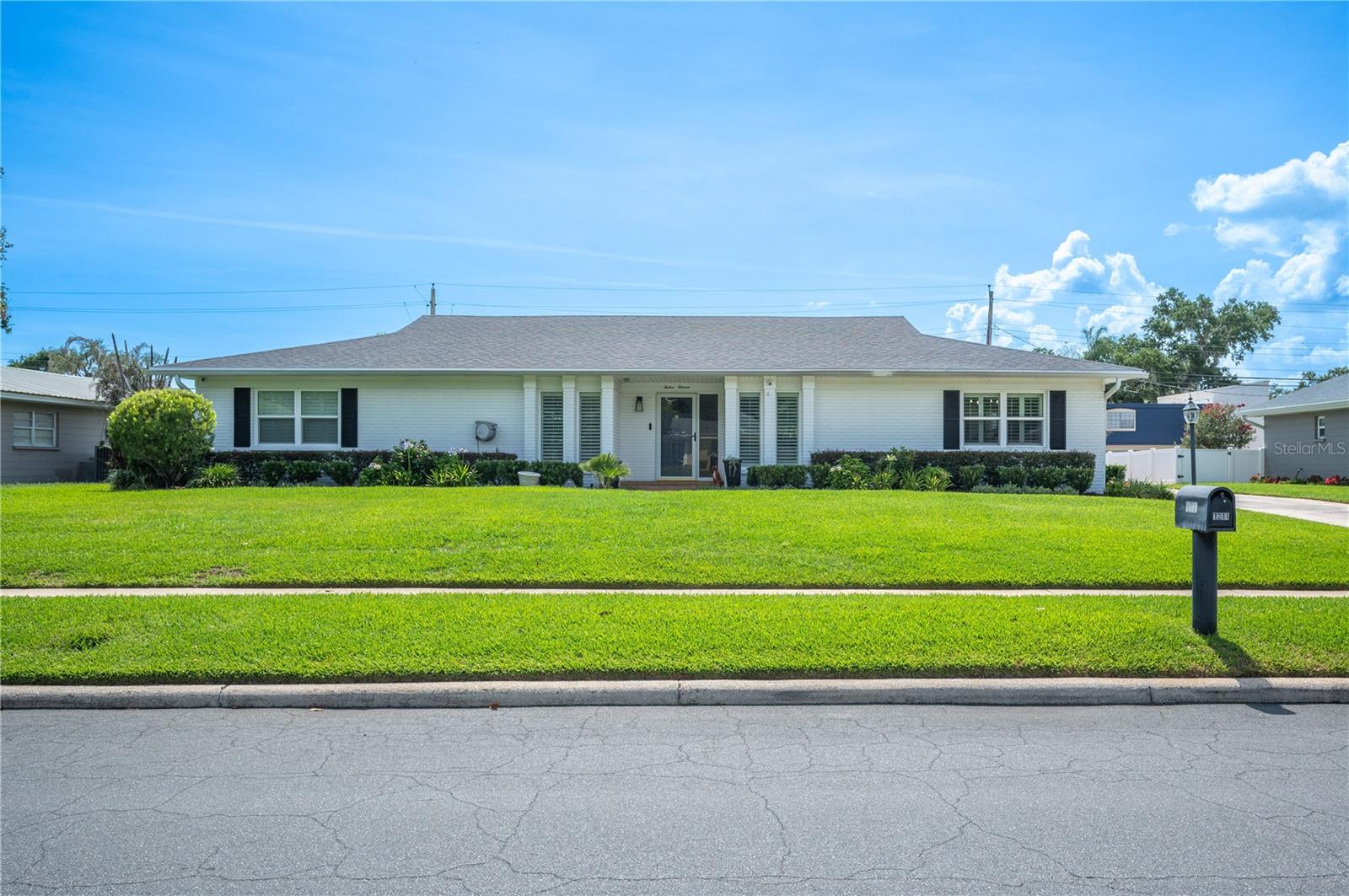 Just steps from beautiful Lake Hollingsworth, welcome to 1211 Hunt Avenue, Lakeland, FL 33801. Situated on a spacious 0.31-acre lot, this fully renovated 4-bedroom, 2.5-bath home offers a fresh, modern design with an exceptional floor plan created for both comfortable everyday living and effortless entertaining.
From the moment you enter, you'll appreciate the thoughtful updates throughout, including new luxury vinyl plank flooring (2023), new energy-efficient windows (2023) accented with classic plantation shutters, recessed lighting, and stylish designer light fixtures.
The beautifully renovated eat-in kitchen is the heart of the home, featuring quartz countertops, abundant custom cabinetry, stainless steel appliances (2023/2024), and generous prep and storage space—perfect for both casual meals and hosting family and friends.
The spacious primary suite serves as a private retreat with a beautifully updated en-suite bath and generous closet space. Three additional oversized bedrooms provide flexibility for family, guests, or a home office and are all beautifully finished and move-in ready.
One of the home's most unique features is the enormous bonus/game room, complete with a new mini-split A/C system (2023) and its own private entrance. This versatile space is ideal for entertaining, a media room, fitness studio, playroom, home business, or guest suite.
Step outside to enjoy the newly screened oversized lanai, creating the perfect setting for morning coffee,  dining el-fresco, or relaxing in the evening.
The location is equally impressive. Nestled within Lakeland city limits in one of the area's most desirable and walkable neighborhoods, you're just moments from scenic Lake Hollingsworth, parks, walking trails, recreation, Cleveland Heights Golf Course, excellent schools, shopping, restaurants, and medical facilities. This exceptional combination of location, thoughtful renovations, flexible living space, and modern updates makes this home truly move-in ready and a rare opportunity to enjoy one of Lakeland's most sought-after neighborhoods.
Major improvements provide exceptional peace of mind, including:
New roof (2020)
New HVAC system (2025)
New ductwork and insulation (2023)
Newer water heater
Updated irrigation system
Exterior security cameras
Washer & dryer convey.
~ wired for a generator
..see the full improvement feature sheet in the MLS attachments tab.