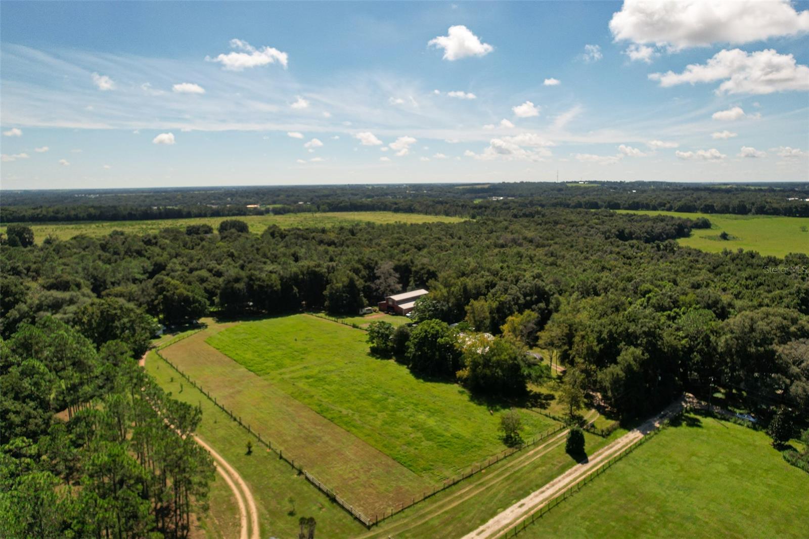 FELLOW REALTORS BRING A BUYER**
Rare opportunity to purchase a 30-acre, working farm located just 6.7 miles from interstate 75 and minutes from downtown Dade City.
The property features a small family block home, 2 barns - 1 oversized fully enclosed metal barn with water, electric, and a 2nd floor deck overlooking a wooded area, the 2nd one is a large pole barn.
Plenty of room for all possibilities including development.
