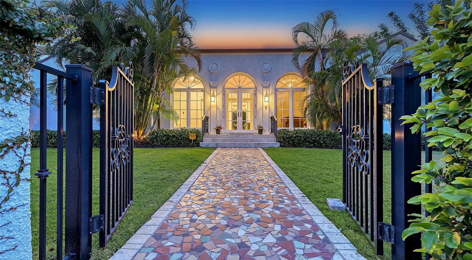 This stunning, newly renovated 4 bedroom, 4 and a half bath Mediterranean Revival estate, designed by Sarasota's renowned first architect, Alex Browning, seamlessly blends timeless elegance with modern luxury. Nestled on a lush, oversized lot of just under 20,000 square feet, this home offers privacy, tranquility, and exceptional craftsmanship. Boasting 10-foot ceilings and 9' French doors throughout, the home is bathed in natural light, highlighting the newly installed French oak hardwood floors. The chef’s kitchen is a dream, featuring exposed beams, a quartz center island, and a professional AGA Legacy 44” 6-burner gas range, perfect for preparing gourmet meals. Oversized Primary Bedroom leads into the newly renovated Primary Bath offering a spa-like experience, complete with a massive walk-in steam shower, a freestanding tub, and designer finishes. Each of the 3 Guest Bedrooms are spacious and ensuite, ensuring privacy and comfort for all.  The estate-sized completely fenced, lushly landscaped and private backyard area includes vintage fountains, a partially covered courtyard perfect for entertaining and an oversized pool. With updated electrical, PVC plumbing, and impact glass windows/doors, this home is as functional as it is beautiful. Located just steps away from shopping and dining in the desirable Southside Village and minutes away from vibrant downtown Sarasota, this home offers both convenience and sophistication in one of Sarasota’s most sought-after areas. 
Effective year built 2019 as found on Sarasota County Property Appraiser site