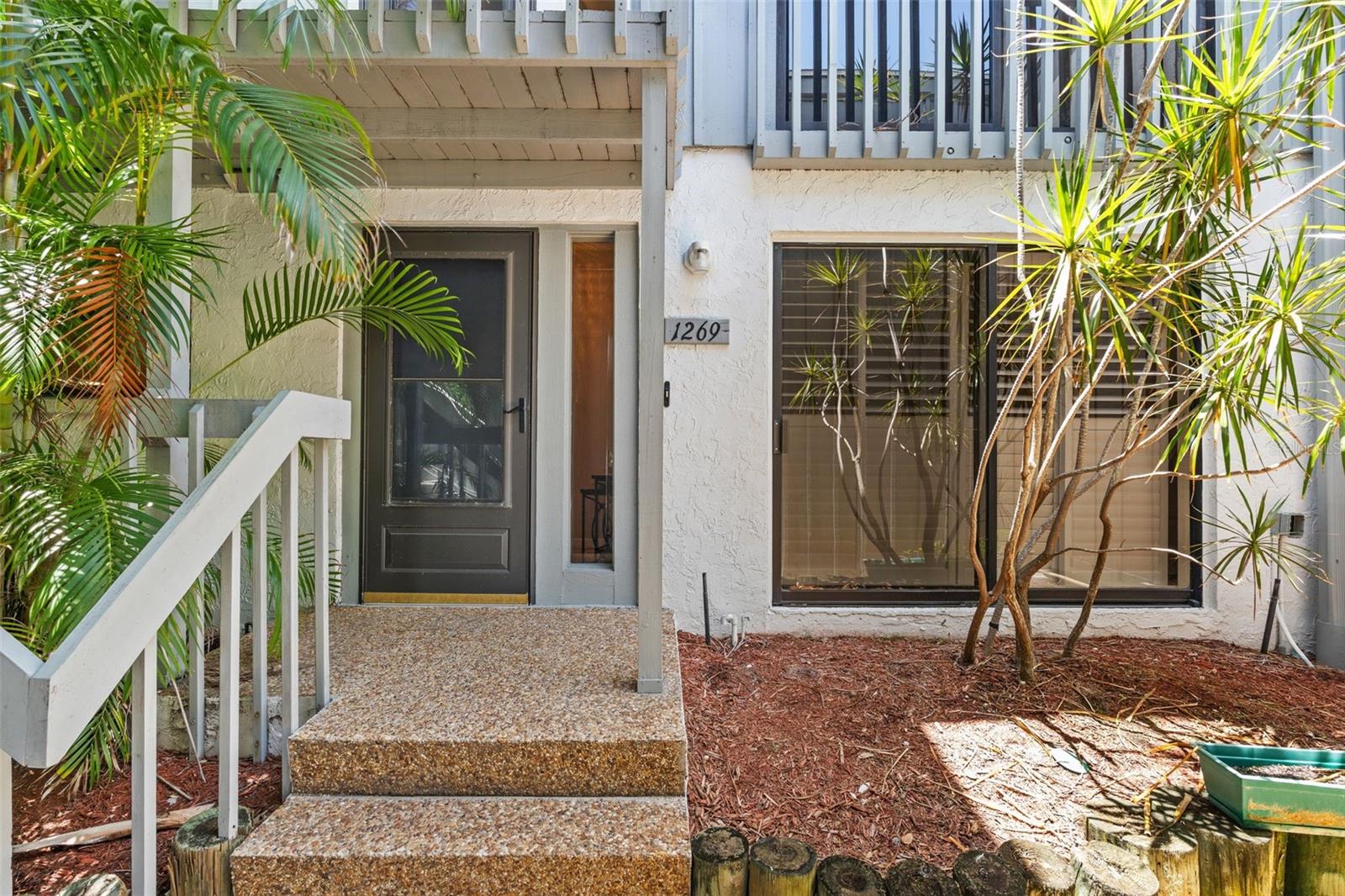 This spacious condo has easy access to Siesta Key Beach and a DEEDED 25-FOOT BOAT SLIP WITH A LIFT!!  There is water and electric to the slip (#38). Yes, this is a rare opportunity to have both your boat and a nearby world-famous beach in a nicely laid out two-bedroom, two-bath turnkey furnished condo. The master bedroom has views of the harbor while the guest room has a peaceful garden view. This condo features tile flooring throughout with both HVAC and appliances that are only a couple of years old. The roof was replaced in November 2021, and the unit has a one-car garage with storage above as well as a dedicated parking space in front. In addition, this unit has one of the few private outdoor decks in the community.  Harbour Towne offers fantastic amenities, including a clubhouse, heated pool, spa, and tennis/pickleball courts. Enjoy the village by day or evening for great dining, shopping and live music. A complimentary trolley runs by the complex on a regular schedule in season. This is a great place to live and play!  Look no further, this is where your fun-filled life begins.