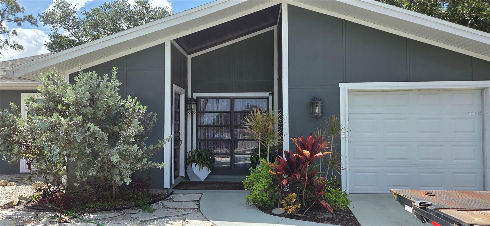 221 DADE AVE.  4bd/2ba $575,000
4 bedroom, 2 bath home features an extra large circular driveway and sits on 1/3 of an acre. No deed Restrictions with plenty of room to build out and/or park vehicles, RV and boat. This one of a kind built home on a cul-de-sac has been fully remodeled inside and out.
The house opens to a vaulted ceiling in the large living area and features a tongue in groove ceiling in cedar.
Most renovations have been completed in the last 5 years. Brand New Oversized European Eat -In Kitchen with finished cabinet interiors and granite countertops. Mined Stone Slate tile from India throughout. 4th bedroom can be an office or den with coordinated laid stone tile work. Ikea and Floor and Décor Remodeled bathrooms and New Carpeting and new plush padding in all the bedrooms, New Modern Hunter Ceiling fans in every room and 3 fans outdoors in the screened pool lanai. Double walk in closets in the Master and Easy entry walk-in shower with floating glass wall and waterfall showerhead. New woodwork, carpentry and fixtures throughout.
New Windows and Upgraded window coverings for all windows and sliding doors included for immediate privacy in this like new home built perfectly for a family. Newly completed $7,000.00 garage remodel with new ceiling and epoxy flooring.
New pool surface and New pool cage 2022. Roof is less then 10 years old and a brand new electrical panel replaced with room on the panel for additions.  Features a new Kinetico whole home water purification system and RO purified water in the kitchen. Kitchen Sliding doors to the pool and patio with room for an outdoor kitchen. The home comes equipped for RV hookup on the side of the house.
Expansive backyard with landscape built out like the start of a tropical sanctuary. A hundred species of birds have visited the creek at the back end of the property.
Home sits minutes from right between Downtown Sarasota and UTC. 14 blocks to the oceanfront, 3 miles to Lido Beach.
Upgrades do not reflect on the appraisal. This is not a cookie cutter house with plastic floors and discount cheap material updating. House is solid and built with higher standards. Like stepping into Florida life with a beautifully appointed home for parties and entertaining. Home is move in ready, meticulously clean. Some furnishings may be left for an additional price and at the buyers request.
No Lowball offers. Cash Buyers Welcome.