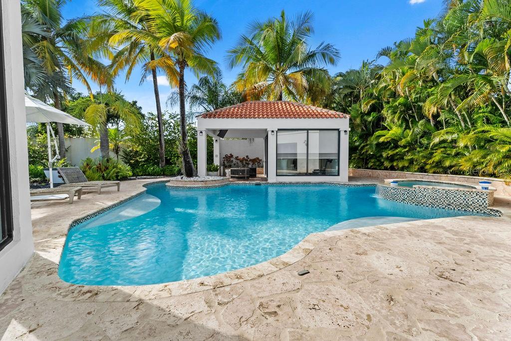Discover the best Dorado Beach East one story home in this fully remodeled and expanded Golfer model home. A true move-in-ready property offered fully furnished and equipped, just pack your toothbrush. 

Located on a corner lot in a quiet cul-de-sac, the 1,334-square-meter property offers privacy and convenience near the South Gate of Dorado Beach East.

The outdoor space is designed for relaxation and entertainment, featuring a large pool, an air-conditioned gazebo that doubles as a guest house or office, a cold plunge, an outdoor shower and bathroom, and a BBQ grill area. The lush landscaping, complete with a small pond, creates a serene setting for gatherings or quiet moments.

Inside, the home features 4 spacious bedrooms, 4.5 bathrooms, an open-concept kitchen and dining area, a bright living room with cathedral ceilings, and a TV room that opens to the outdoor space. The master suite includes a spa-like bathroom and a walk-in closet.