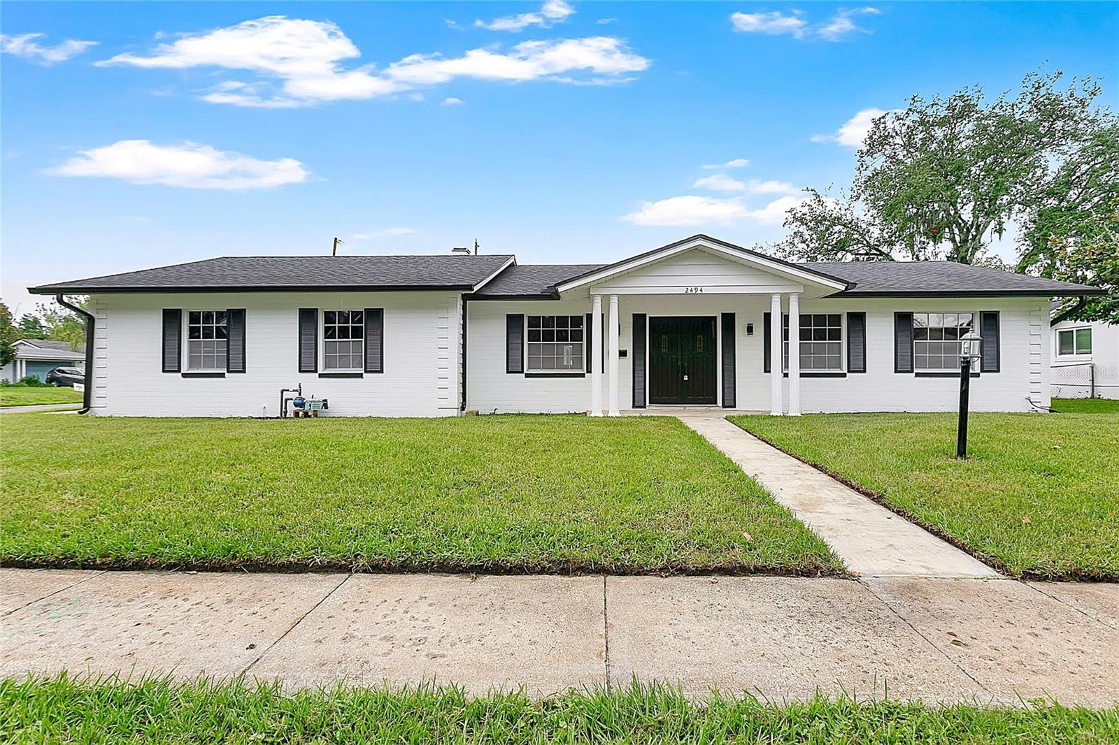 Welcome to 2494 Castlewood Road, a beautifully updated pool home situated on a spacious corner lot in one of Maitland's most established neighborhoods. This move-in-ready residence offers peace of mind with a newer roof, solar panels, updated HVAC, and extensive interior renovations throughout.

Inside, you'll find an open and inviting floor plan featuring luxury vinyl flooring, updated bathrooms, modern fixtures, quartz countertops, and custom cabinetry. The spacious primary suite includes a walk-in closet and renovated en-suite bath, while the additional bedrooms provide flexibility for family, guests, or a home office.

A large screened Florida room overlooks the backyard and creates the perfect space for year-round entertaining. Outside, enjoy the oversized swimming pool, expansive patio deck, fully fenced yard, and storage shed, offering plenty of room for recreation and outdoor living.

Conveniently located just minutes from Downtown Maitland, Winter Park, Park Avenue, AdventHealth, shopping, dining, and major roadways including I-4, this home combines modern updates, energy-efficient features, and an exceptional location in the heart of Central Florida.