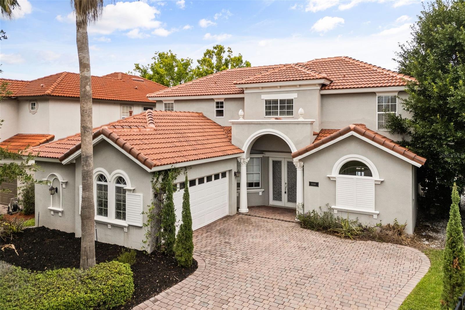 BRAND NEW TILE ROOF. Nestled within the prestigious gated community of Belmere in Windermere, Florida, this exceptional Mediterranean resort-style pool home offers a rare opportunity to own one of the community's most unique properties. Beautifully maintained and extensively updated by its meticulous owners, this move-in-ready 5-bedroom, 2.5-bathroom residence features 2,366 square feet of thoughtfully designed living space, a brand-new tile roof, and breathtaking views overlooking a tranquil private pond. Every detail has been carefully cared for, creating a home that blends timeless elegance with modern convenience.
Step inside to discover a bright, open-concept floor plan designed for both entertaining and everyday living. The spacious main living areas flow seamlessly into the kitchen and dining spaces, creating an inviting atmosphere for family gatherings and special occasions. The primary suite is conveniently located on the main floor, offering privacy and comfort with generous space and a well-appointed ensuite bath. Four additional bedrooms provide flexibility for guests, a home office, or growing families. Throughout the home, you'll appreciate the pride of ownership and thoughtful updates that make this property truly turnkey.
The outdoor living space is where this home truly shines. Designed as a private Mediterranean-inspired resort, the backyard features a spectacular screened-in pool and an impressive 12-person jacuzzi, creating the ultimate setting for entertaining or relaxing. In 2024, the pool system was upgraded with top-of-the-line app-controlled automation, allowing you to effortlessly control lighting, heating, water features, and more directly from your smartphone. Whether you're hosting unforgettable gatherings, enjoying peaceful evenings under the stars, or taking in the serene pond views with your morning coffee, this extraordinary outdoor oasis delivers a luxury lifestyle that is rarely found in Belmere.
Located just minutes from top-rated schools, shopping, dining, and Central Florida's world-famous attractions, this exceptional Windermere home offers the perfect combination of luxury, comfort, and convenience. With its brand-new tile roof, extensive updates, resort-style amenities, and impeccable maintenance, this is a truly move-in-ready home that stands apart from the rest.

UPGRADES: Brand-new tile roof (2025),  new Hot water heater (2025), a fully modernized pool and spa system (2024) featuring app-controlled Wi-Fi automation, upgraded Jacuzzi, fountains, and pool heater, a new Samsung gas range (2024), all new pool enclosure screens (2025), Google Home smart thermostats on both floors, and a new overhead garage ceiling storage system.